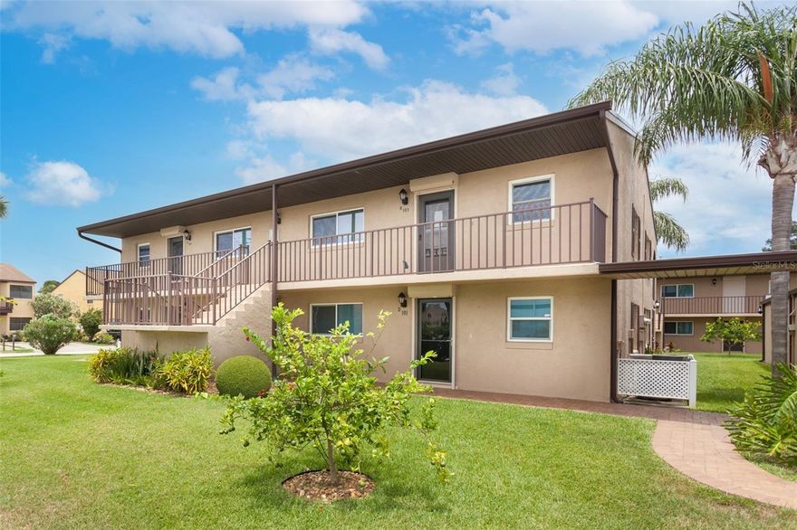 Minutes from the Atlantic Ocean and Port Canaveral, this FULLY FURNISHED 2-bed, 2-bath second-story condo offers the perfect beachside retreat. MOVE-IN READY and beautifully maintained, it features tile flooring throughout, impact windows, electric hurricane shutters, and an open living/dining floor plan. This END-UNIT condo features extra windows and abundant natural light. The split-bedroom layout provides privacy, and the updated kitchen includes a breakfast bar and eat-in space, ideal for entertaining or extended stays. Relax on the private shaded balcony with views of rocket launches. The spacious primary suite features an updated shower and walk-in closet. A new AC unit was installed in 2022 for year-round comfort. Includes a one-car garage with built-in shelving for extra storage. Near vibrant restaurants, nightlife, and entertainment, this immaculate condo offers a rental opportunity or your chance to own a slice of paradise and enjoy the Florida lifestyle year-round. Schedule your private showing today!