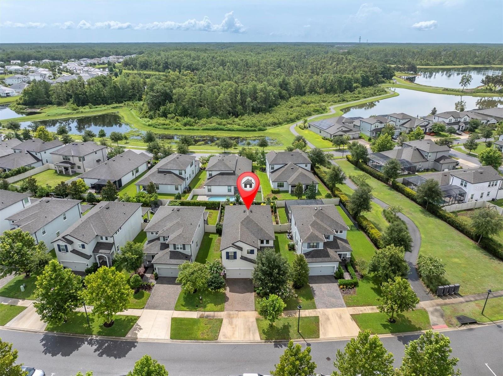 ELEGANT 4 BR HOME IN DESIRABLE STARKEY RANCH! Welcome home to your charming MI Homes CYPRESS boasting 4/3/2 PLUS Bonus Room and a huge fenced back yard with an extended screened paver lanai conveniently situated on a quiet street in Desirable Starkey Ranch. Custom designed in 2019 with plenty of upgrades, this intelligently positioned & popular OPEN FLOOR PLAN offers 2585 sqft of functional living space for entertaining & everyday life. The attractive exterior has exceptional curb appeal thanks to the attractive shutters, beautiful stone work, paver driveway, beautifully manicured landscaping bursting with flowers and an inviting front porch. A shaded glass inlay front door greets guests. As you enter the home, an impressive wood staircase with wrought iron spindles, stylish chandelier and 3-accent windows capture your attention. Noteworthy upgrades include a consistent warm ENGINEERED HARDWOOD flowing throughout the main floor, plantation shutters and crown molding. To the right of the foyer is a Full bath with walk in shower and a generously sized bedroom 4. This luxurious Chef’s kitchen will steal your heart! Solid Shaker Maple Toffee wood cabinets with crown molding and drawers are accented by brushed nickel hardware, under cabinet lighting and complimented by elegant granite counters and attractive tile backsplash. Spacious island is the centerpiece of this kitchen which seats 3 barstools comfortably and is illuminated by 3 designer pendent lights. Appliances include Refrigerator, 5 burner gas range, Built in Double Ovens & built in microwave and dishwasher. Dimmable can lights in kitchen & living room create ambiance. An impressive walk in pantry provides extra storage. Adjacent is the eat in café anchored by a chandelier and French Doors leading to patio with views of backyard and garden. The Gathering Room features 3 large windows to let in natural light, space to support any furniture configuration & ceiling fan plus can lights. Ascend the stairs to the 2nd story with a small reading nook or multipurpose area. The secluded, spacious Primary retreat on the second story, elicits feelings of comfort and rest featuring Crown Molding, ceiling fan + can lights & 2 windows. Primary ensuite w/ tile floors, Quartz counters, dual sinks with makeup seat, Toffee Maple cabinets & drawers and spacious walk-in shower w/ listello. There are 2 additional well-sized bedrooms and another full bath with dual sinks & tub/shower combo located upstairs. The laundry room with open shelving & folding table is also conveniently located on the 2nd floor. The fully fenced backyard offers plenty of room for play set or future pool. Enjoy the cheery garden bursting with native plants, flowers and vegetable garden and be delighted by the visiting butterflies. A covered paver patio and additional extended and screened paver deck give you lots of shady space to entertain. Short walk to peaceful Cunningham Park. Additional home features include * 50 gallon Gas water heater *Epoxy garage floor* Garage Storage Racks* Water Conditioning & Softener System* Washer & Dryer* Award winning Starkey Ranch offers K-8 STEM School, Cultural Center, Theater, Library, 3 community pools, 3 playgrounds, 3 dog parks, 20 mile trail system for walking & biking, a community center & garden, kayaks on Cunningham Lake, ongoing events for all ages and so much more. Close to Starkey Ranch Publix, restaurants, beaches and easy commute to Tampa airport. Make your move! This is Home!