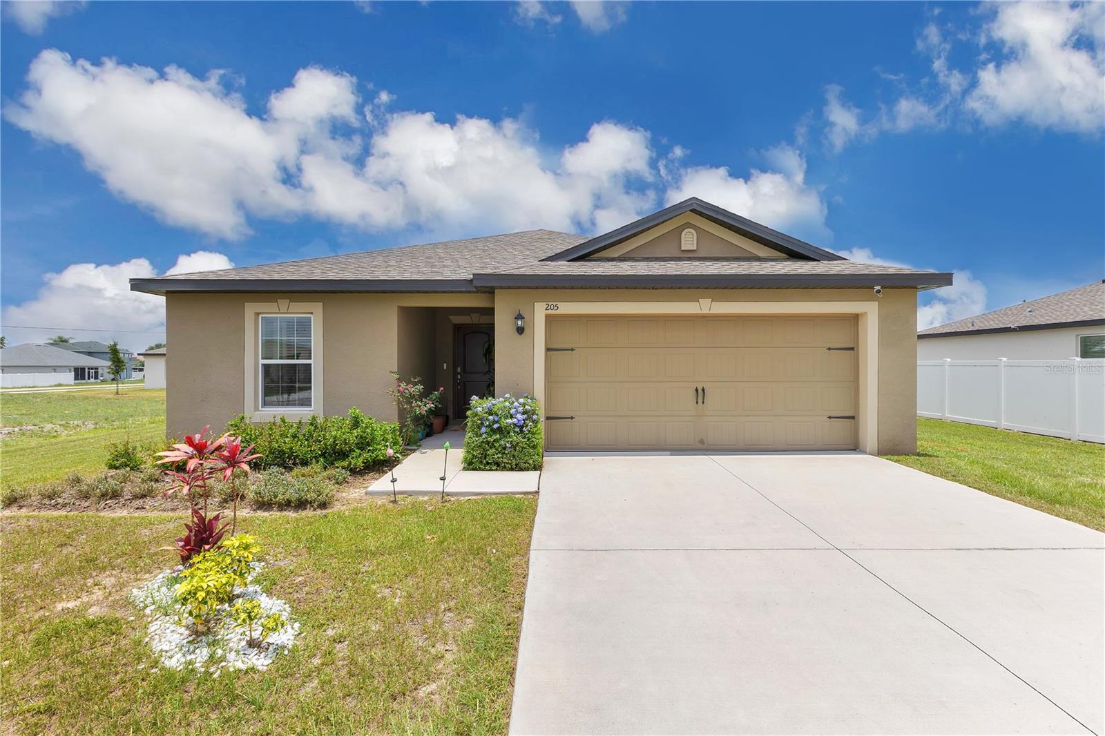 Welcome Home! This move-in ready, single-story home offers the perfect blend of modern design, comfort, and efficiency. Built in 2022, this energy-efficient 3-bedroom, 2-bath home showcases a spacious open-concept layout filled with natural light and contemporary finishes. The kitchen is both stylish and functional, featuring granite countertops, stainless steel appliances, 36” upper cabinets with crown molding, and brushed nickel hardware—perfect for everyday living or entertaining. The private primary suite includes a walk-in closet and a beautifully appointed en-suite bathroom. Additional highlights include a two-car garage, extended driveway parking, and modern lighting fixtures throughout, a water filtration system for the entire house. Located in the amenity-rich Association of Poinciana Villages, you'll enjoy access to parks, pools including an indoor Olympic size pool, state of the art fitness center, playgrounds, sports courts, and more: definitely is a life style worth belonging to. Don’t miss the opportunity to make this well-maintained property your place to live and enjoy—schedule a private tour today!