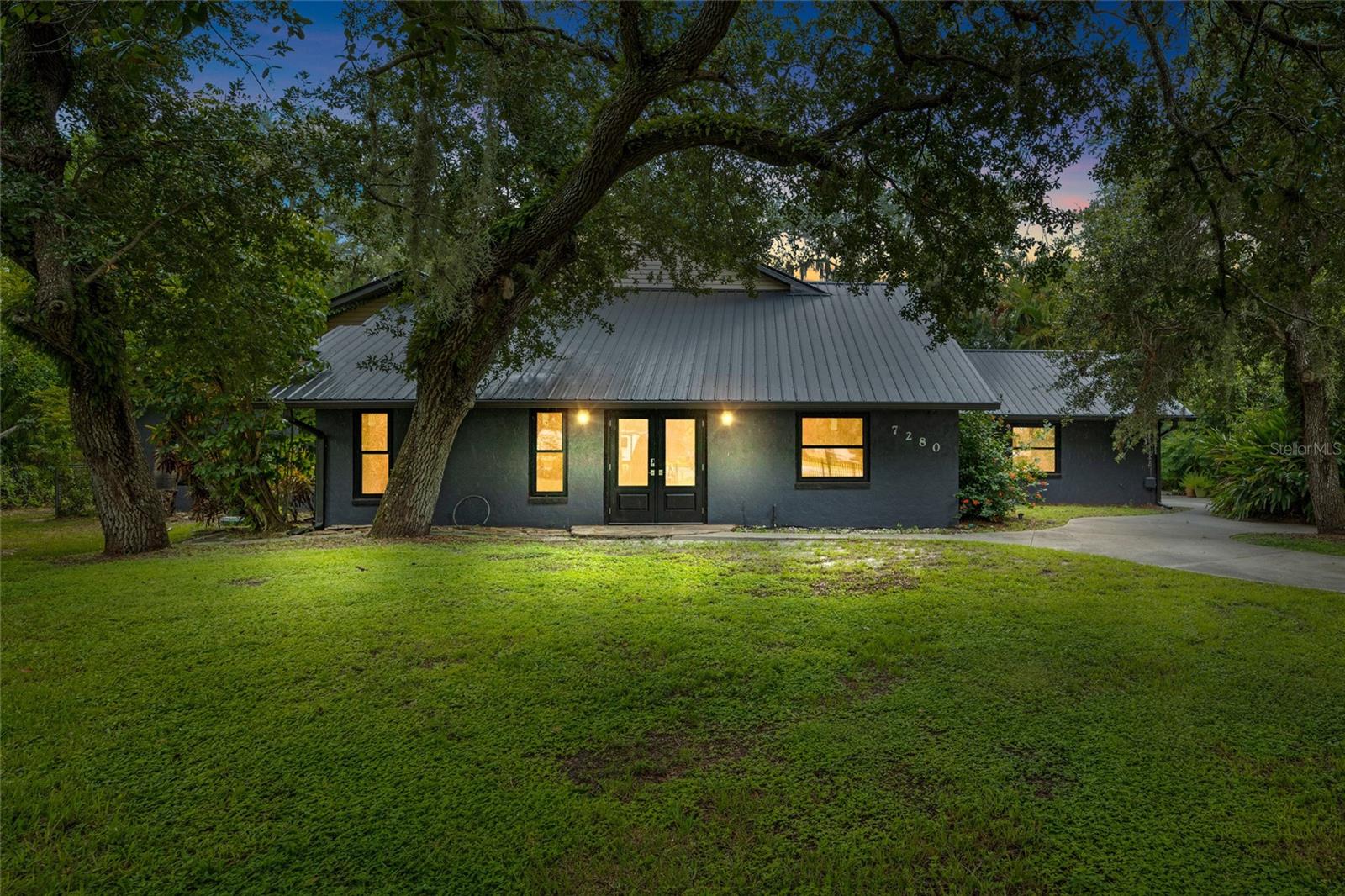 THIS HOUSE HAS BEEN WAITING FOR YOU! Families and large gatherers come see this rare find in the highly sought after Daughtrey's Creek Community just waiting for you to bring it back to life! This gulf-access gem is tucked away on .72 acres. A beautiful 4BR/3BA pool home offers a spacious layout with a large formal living room with a connected dining nook, a family room with a wet bar hookup, and a large kitchen. Primary suites upstairs and down, plus a loft, inside laundry, an oversized A/C-equipped garage, and a whole-home Wall Vac system. Outdoor living shines with a heated Level 2 PebbleTech resurfaced pool (2024), epoxy-coated patio deck, fenced in yard, a utility shed with electricity, and a wood dock! Major recent upgrades include: new metal roof (2023), 3 new A/C units (2022), new water heater (2023), electrical panel upgrade (2025), Water filtration system (2023), lighting, appliances and first floor bathroom renovations throughout. Surrounding you and your family with a peaceful preserve backdrop, mature oaks, and a private setting make this a rare find that just needs YOUR PERSONAL TOUCH to be perfection! Choose your flooring, interior paint, interior doors, and lower cabinetry to make it a home again… YOUR HOME!