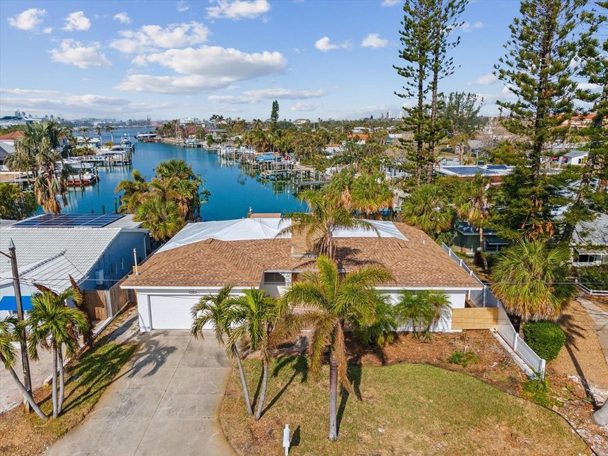 St. Pete Beach waterfront paradise! Come see this amazing view! This location is nestled at the end of a saltwater canal and is a boaters haven. From your dock you can easily reach the intercoastal and the Gulf of Mexico in under five minutes! This property was damaged during hurricane Helene but come renovate or rebuild in this highly sought-after area. Discover your dream coastal retreat! This stunning 2-bedroom, 2-bathroom waterfront home is perfectly situated just a short stroll from downtown St. Pete Beach and award-winning Upham Beach where you can enjoy breathtaking sunsets every evening. Inside, this home boasts an open and airy layout, perfect for entertaining or relaxing. The spacious living areas are filled with natural light, and the kitchen offers plenty of opportunities for entertainment. The primary suite features a private bath, while the second bedroom is perfect for guests or a home office. You'll love being walking distance to shopping, dining, and entertainment, making every day feel like a vacation. Whether you're looking for an active beach lifestyle or a serene waterfront escape, this home has it all! Don’t miss out on this rare opportunity to own a slice of paradise! Schedule your private showing today and start living the coastal dream.