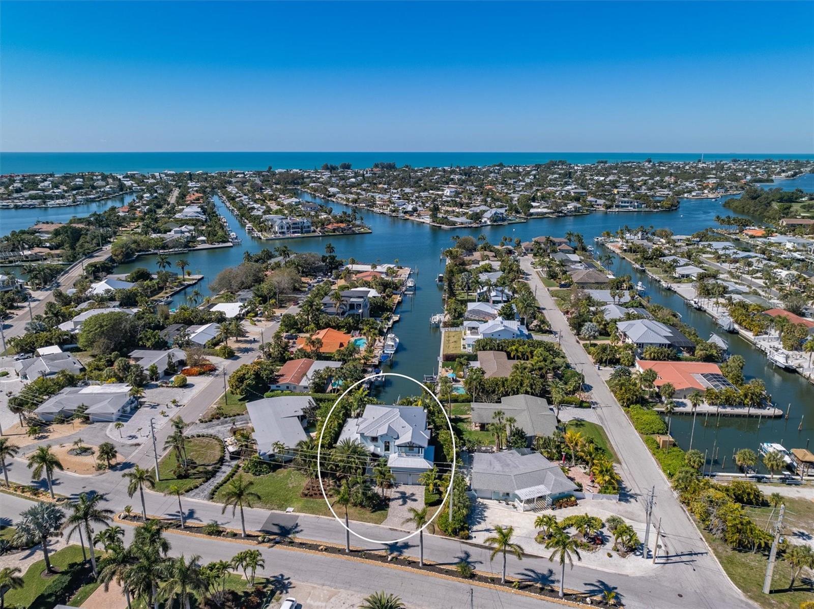 This 4 bedroom, 5 bathroom home is one you won’t want to miss! This canal front home is located in quiet Key Royale and offers the ultimate waterfront living experience. You are welcomed by gorgeous sunsets in your backyard every night while dolphins and manatees frolic in the canal. As you step inside, you're greeted by a spacious and bright interior adorned with modern finishes and coastal charm. The open-concept living area is perfect for entertaining, with large slider doors that frame picturesque views of the canal and invite in an abundance of natural light. The gourmet kitchen boasts high end stainless steel appliances, quartz countertops, and ample cabinet space, making it a chef's delight. One great feature is there are 2 luxurious master suites, one on the ground level and another one on the second floor. They each have huge walk in showers and separate soak in tubs, dual sinks and walk in closets. The other 2 bedrooms are also on the second floor and have their own bathrooms and all 3 bedrooms upstairs share a grand balcony over looking the pool and the extensive canal views. Fishermen will love the fact that there is direct access to Bimini Bay and the Tampa Bay intercostal. Keep your boat on the lift and enjoy the large dock to fish off of. Located in the prestigious Key Royale neighborhood, there are many amenities to enjoy such as golf course, tennis/pickleball courts and more! Large oversized 2 car garage and an elevator too! Schedule your private showing today!