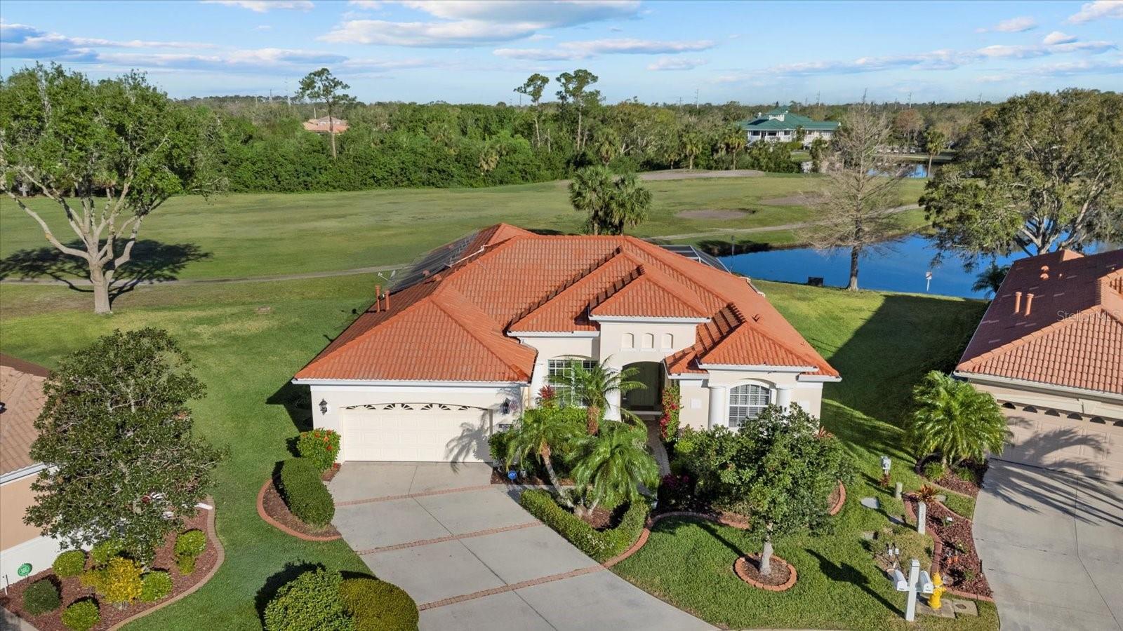 Beautiful Lee Wetherington Home located in the highly sought after Tara Preserve. Situated on a private cul-de-sac lot with preserve and lake views. This residence offers 4 bedrooms and 3 baths. The gourmet kitchen features wood cabinetry, an island, stainless steel appliances and granite countertops. Eat in kitchen area and separate dining room. Large open family room and additional living room. Primary bedroom with en suite bath featuring a walk-in shower, separate tub and walk-in closet. This home has many upgrades to include crown molding and custom wood casing around all windows. Other features include tile and laminate flooring. Home is hardwired for security camera system and speakers throughout. The outdoor oasis has a private heated pool that uses both electric and solar and an outdoor kitchen for entertaining. Tara Preserve amenities offers a heated pool, spa, tennis and pickelball courts and a clubhouse. Prime location, close to the best beaches in Sarasota/Bradenton, shopping and highways. Schedule your private showing today!