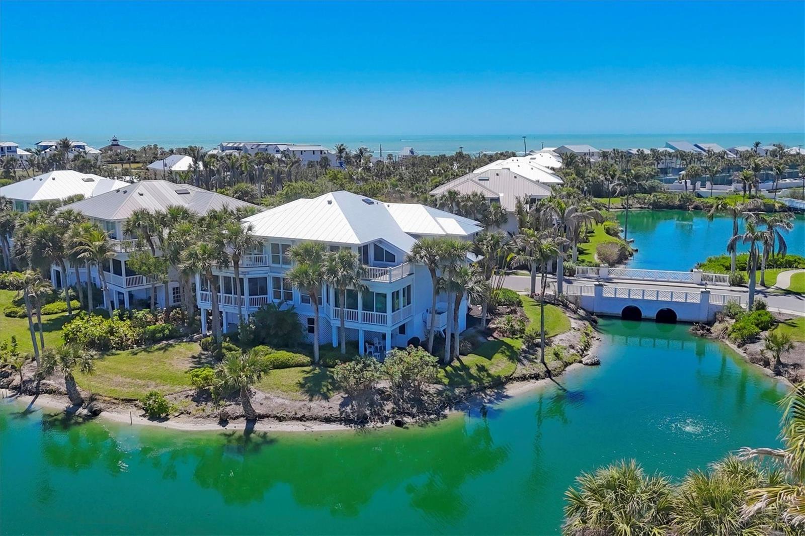 Discover unparalleled coastal elegance at 805 S. Harbor Drive. This exquisite 3-bedroom, 3-bathroom townhome spans 2,034 square feet and is situated within the beautiful gated community of South Village in Boca Bay. Built in 2000, the residence offers serene lake views, newly installed elevator and new metal roof in 2023.
Upon entering, you're greeted by a thoughtfully designed interior that seamlessly blends comfort and sophistication. The open-concept living spaces are bathed in natural light, enhancing the tranquil ambiance. The master suite serves as a private retreat, offering expansive views and luxurious amenities.
The spacious enclosed under air porch provides a perfect space to simply unwind while overlooking the picturesque lake. Residents of South Village enjoy access to exclusive Boca Bay community amenities, including the Boca Bay Pass Club, swimming pools, tennis and pickle ball courts, and private beach club , community dock, and fishing pier all meticulously maintained to the highest standards.
Located just moments from the charming boutiques and gourmet dining of downtown Boca Grande, this property offers both seclusion and convenience. Whether you seek a year-round residence or a seasonal getaway, 805 S. Harbor Dr presents an unparalleled opportunity to experience the epitome of luxury coastal living.