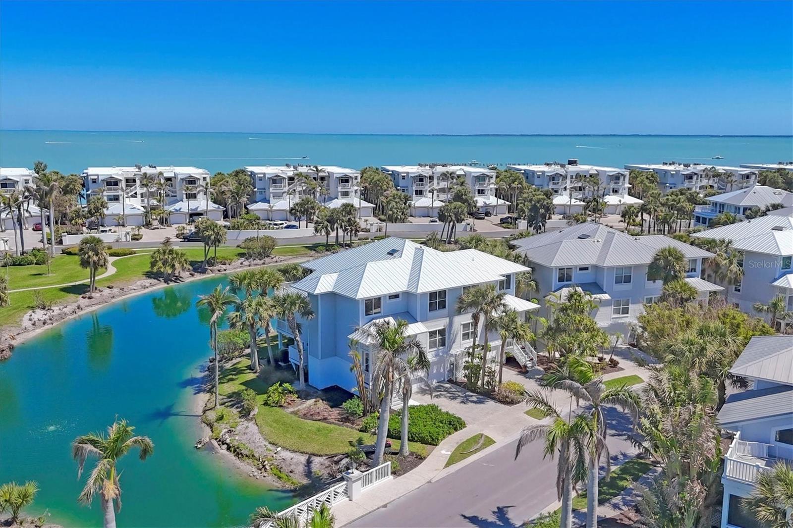 Discover unparalleled coastal elegance at 805 S. Harbor Drive. This exquisite 3-bedroom, 3-bathroom townhome spans 2,034 square feet and is situated within the beautiful gated community of South Village in Boca Bay. Built in 2000, the residence offers serene lake views, newly installed elevator and new metal roof in 2023.
Upon entering, you're greeted by a thoughtfully designed interior that seamlessly blends comfort and sophistication. The open-concept living spaces are bathed in natural light, enhancing the tranquil ambiance. The master suite serves as a private retreat, offering expansive views and luxurious amenities.
The spacious enclosed under air porch provides a perfect space to simply unwind while overlooking the picturesque lake. Residents of South Village enjoy access to exclusive Boca Bay community amenities, including the Boca Bay Pass Club, swimming pools, tennis and pickle ball courts, and private beach club , community dock, and fishing pier all meticulously maintained to the highest standards.
Located just moments from the charming boutiques and gourmet dining of downtown Boca Grande, this property offers both seclusion and convenience. Whether you seek a year-round residence or a seasonal getaway, 805 S. Harbor Dr presents an unparalleled opportunity to experience the epitome of luxury coastal living.