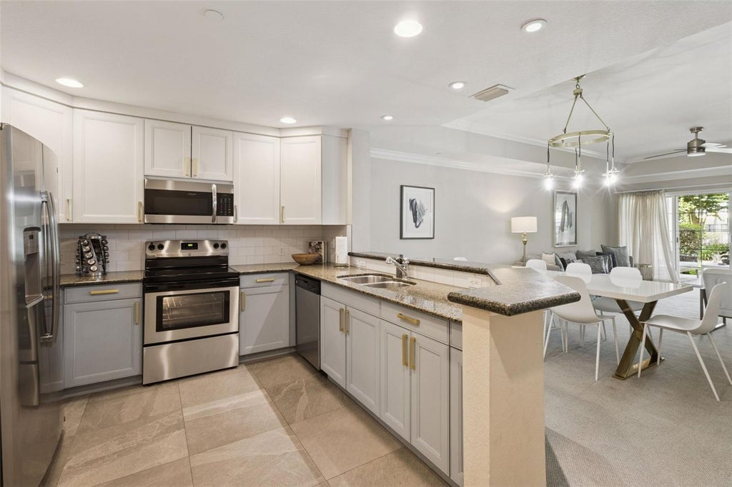 Photo of 7602 Sandy Ridge Dr #102, Kissimmee, FL 34747 (MLS # O6423637)