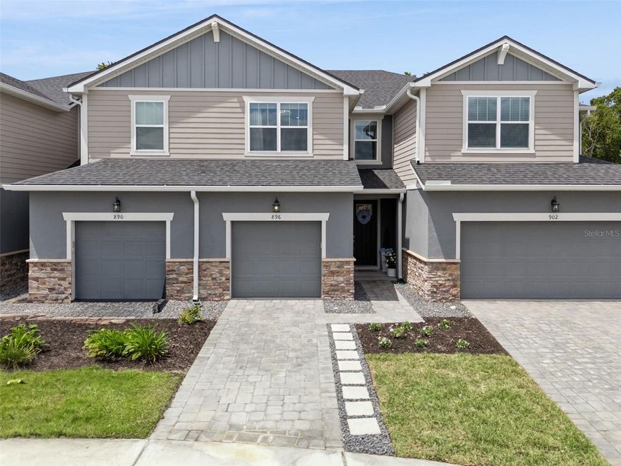 Welcome to this exquisitely curated townhouse in the sought-after Spring Isle Palms, built in 2023 and brimming with luxury. Spanning 1,550 square feet across two floors, this three-bedroom, two-and-a-half-bath residence is a masterpiece of design. A professional interior designer has spared no expense, with custom box molding, crown molding, and designer lighting fixtures throughout including LED sconces in the foyer and upstairs. Luxury vinyl flooring upstairs, plus upgraded carpet on the stairs and in the bedrooms, ensures both style and comfort. Custom drapes, fresh interior paint, and an accent wall add layers of sophistication. The upstairs primary suite boasts serene conservation views from the rear of the home, and the spa-like bathroom dazzles with a glass enclosure, designer mirrors, and premium finishes. Upstairs, two additional bedrooms offer versatility—one ideal as a home office, the other featuring a wood accent wall, perfect for a den. The kitchen is a chef’s dream, with a window over the sink and seamless flow to the private backyard deck, crafted in Trex composite material—perfect for relaxing or entertaining. Additional upgrades include epoxy-coated garage floors, custom built-in cabinets with a folding countertop in the laundry room, extra wire shelving in the upstairs primary closet, and carefully selected accent paint. Residents also enjoy a peaceful setting in a newer community with both pool and playground amenities. Just minutes from shopping, dining, and entertainment, this is a rare blend of elegance and convenience. Ask for the upgrade sheet and schedule your private tour today!
