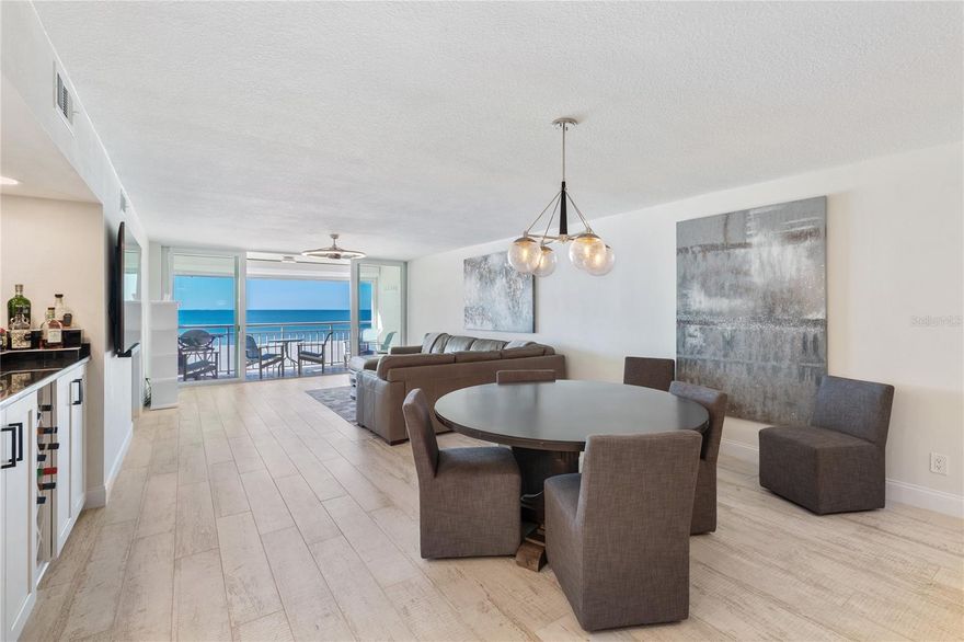 DIRECT, GULF-FRONT CONDOMINIUM! This home is being sold furnished. This beautiful waterfront home has been remodeled from ceilings to the floors.  Ceramic tile floors that look and feel like wood.  Smooth ceilings, Hurricane impact windows and sliding glass doors, Electric storm shutters on the outside of your new balcony and the other Gulf-front windows, both bathrooms are new too.  TRANQUILITY IS EVIDENT FROM THE MOMENT YOU WALK THROUGH THE BEAUTIFUL DOUBLE DOOR ENTRY.  Spacious gourmet kitchen with granite, stainless steel appliances and built in wine fridge.   The unit offers an open concept living space with wet bar. Split bedroom plan with two bedrooms and two baths.  PRIMARY SUITE COMPLETE with private spa like bath and his and her closets.  THIS GEM WILL NOT LAST!