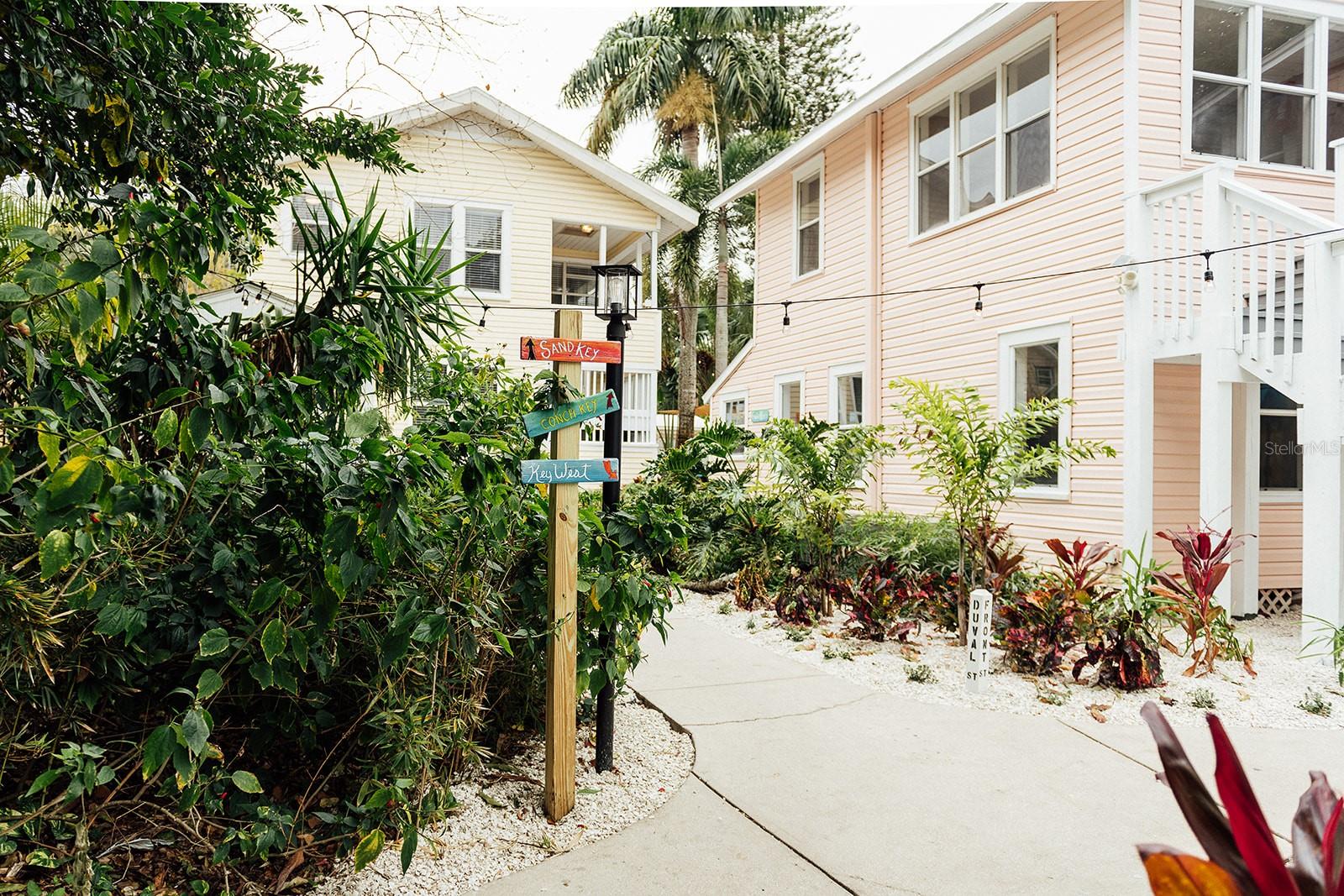 Available for midterm or long-term rental (30+ days) – no short-term rentals. No pets (service animals only). Step into the vibrant Key West vibes of Mallory Square in charming downtown St. Petersburg! This Duval Street-themed 1BR/1BA unit -located on the 2nd floor -is part of a charming boutique Key West Themed complex -designed to feel like a private island retreat in the heart of the city! Fully Furnished and fully stocked. Enjoy a fully furnished unit with bright, tropical décor and thoughtful touches throughout. Rent includes all utilities and high-speed internet. AC via mini-split and window units. Professional laundry service provided at move-in and move-out, plus onsite shared laundry accessible via app (additional charges) during your stay. Additional cleanings available upon request for a fee. Location Highlights: Nestled in a walkable, colorful neighborhood just minutes from downtown St. Pete, you’re steps from local coffee shops, unique restaurants, and boutique shopping. Explore nearby Central Avenue, Vinoy Park, Museums, and a short drive to St. Pete Beach, or relax in the laid-back charm of Mallory Square’s tropical courtyard with lush landscaping and turf.
Move-in requires first month’s rent, cleaning fee, and security deposit. 7 apartments available in total. 2bd/1ba and 1bd/1ba. Inquire with agent for availability and pricing.