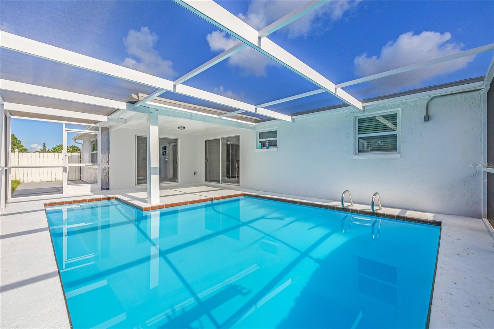 WELCOME TO YOUR AMAZING HOME. NO FLOOD ZONE! NO HOA & NO DEED RESTRICTIONS. POOL HOME. There is SO MUCH TO LOVE about this COMPLETELY RENOVATED HOUSE! Beautifully remodeled home in Holiday, Florida. This newly renovated, pet-friendly home has all the features and space that you and your entire family will enjoy, featuring a 3 bedroom and 2-bathroom POOL HOME home. Brand-new kitchen and appliances with quart counter tops. This home has an abundant of natural light and decorative electric fireplace. Windows in every room. Both bathrooms are completely updated with updated fixtures. A light wood luxury vinyl plank flooring throughout gives the house a great flow. Brand new roof, exterior doors, windows throughout the house. A/C 5 years old. This home needs nothing, it is move in ready! FULLY FENCED YARD! Location is 10 minutes to the Gulf of Mexico and 10 minutes to historic downtown New Port Richey and Tarpon Springs sponge docks. You are steps away from the Anclote Coastal Trail for walking/biking. Just few minutes drive to the Anclote River Park where you can enjoy a swimming beach, boat launch, designated fishing areas and a pavilion for picnics! Less than 15 minutes away from the famous Tarpon Springs Sponge Docks and close to shopping, restaurants and entertainment. Also 20 minutes to the expressway and 30 minutes to Tampa international airport! Schedule your tour today!