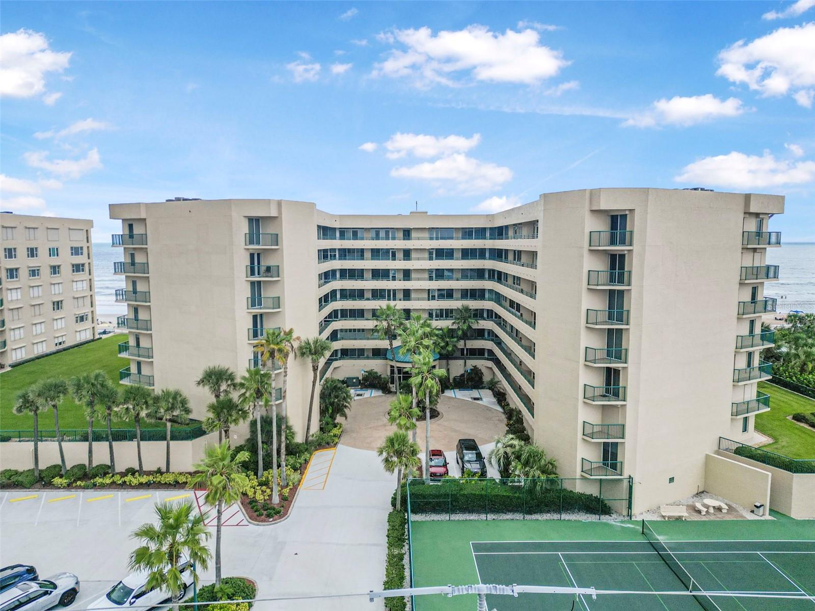 Oceanfront Serenity at The Towers in Ponce Inlet. Wake up to the sound of waves in this stunning direct oceanfront 3-bedroom, 3-bath condominium in the sought-after Towers community. Spanning approximately 2,290 sq ft, this interior unit offers uninterrupted, panoramic views of the Atlantic from its spacious living areas and private balcony. The open-concept layout is designed for coastal living — the living room, dining area, and primary suite all enjoy sweeping ocean vistas, while large sliders fill the home with natural light. The kitchen features ample cabinetry and counter space, perfect for entertaining after a day at the beach. Each bedroom offers its own full bath, providing comfort and privacy for guests and family alike. Built in 1997, this well-maintained condo is part of a resort-style community with amenities that include an oceanfront pool, a fitness center, tennis courts, pickleball, clubhouse, 24 hour gated security and secure underground parking. Step outside and you’re on Ponce Inlet’s pristine beach, ideal for morning walks, shell collecting, or simply relaxing by the shore. Whether you’re seeking a full-time residence, vacation getaway, or investment opportunity, this residence delivers the perfect blend of location, lifestyle, and value.