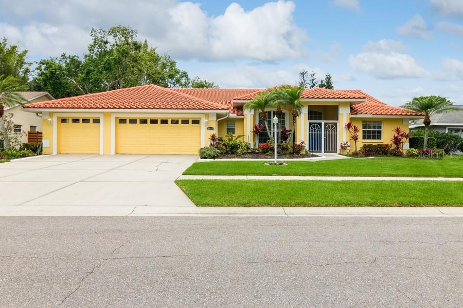Welcome to this magnificent Sarasota home that has it all! This spacious 3-bedroom, 2-bathroom home boasts nearly 2,500 sq ft of living space under air with over a quarter acre lot providing ample indoor/outdoor living space perfect for entertaining and relaxation. The rare 3 car garage offers convenience and additional storage. The modern open kitchen is a chef's delight, featuring quartz counters, a waterfall island/breakfast bar, new soft close cabinets, ivory tile backsplash, and stainless-steel appliances. The stunning open kitchen has a separate breakfast area with convenient sliding glass doors to the screened lanai and is adjacent to the spacious family room, perfect for entertaining. This sun-drenched, comfortable home offers a HUGE primary bedroom that boasts sliding glass doors to the lanai, seating area, well-organized His & Her's walk-in closets, and a lovely, updated spa-like bathroom with mosaic stone shower, whirlpool tub, and dual vanities. Step out back to your own private oasis with a newly refinished pool deck, heated pool, hot tub/spa, and an outdoor shower to rinse off. Relax on your enclosed lanai, read a book on your attached swing, or choose from multiple seating areas on your spacious screened lanai. You can even step outside to your own private tropical paradise and play catch or pick fresh mangoes from your own mango tree. Abundant storage awaits in the well-organized laundry room equipped with a utility sink and even more attached shelving and storage. You'll be amazed by the extensive recent updates, including new A/C, plumbing, electric panel, luxury vinyl plank flooring, and new lighting fixtures, making this home move-in ready. Excellent schools, including highly rated Ashton Elementary, Sarasota Middle School and Riverview HS. Terrific location just 8 miles from world renowned Siesta Key Beach and centrally located to all that Sarasota has to offer, plus very low HOA fees of only $33 monthly. Come quick because this one checks all the boxes!
