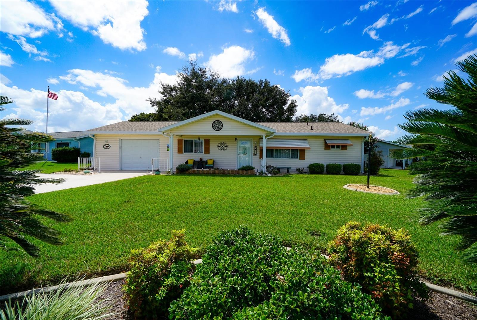 Charming, Cozy & Comfortable Home For Sale in Spruce Creek South, a gated 55+ Golf Community. Large corner lot that's nicely landscaped and has a fenced in backyard of thick and lush lawn with irrigation. Lots of updates come with this 2 bedroom 2 bath home with a split bedroom floor plan, spacious Florida room with its own air conditioning, an enclosed screen room and an outdoor patio grill area, all under cover. Vaulted ceilings, great looking floors with updated kitchen and baths make this home move in ready! Includes an oversized 1 1/2 space garage and the driveway is coated with a beautiful acrylic coating. This isn't a place that some investor bought and quickly fixed up, this home has been in the family for years and very well maintained with a New Roof in 2021 and a New HVAC A/C in 2020. The community features The Links Golf Club and Clubhouse, an exercise facility, saunas, showers, a heated pool with a separate jacuzzi, outdoor bath facilities, Pickleball, Tennis, Bocce Ball courts, billiards room, library, and card rooms. If you're looking for a cozy and adorable home to settle into, you've found it here. Make your plans to see this fine home today!