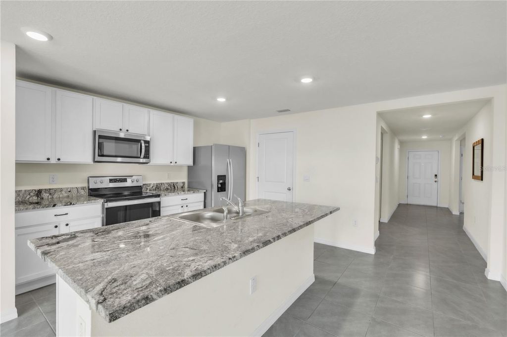 Photo of 7518 Rosewood Garden Loop, Tampa, FL 33637 (MLS # A4667715)