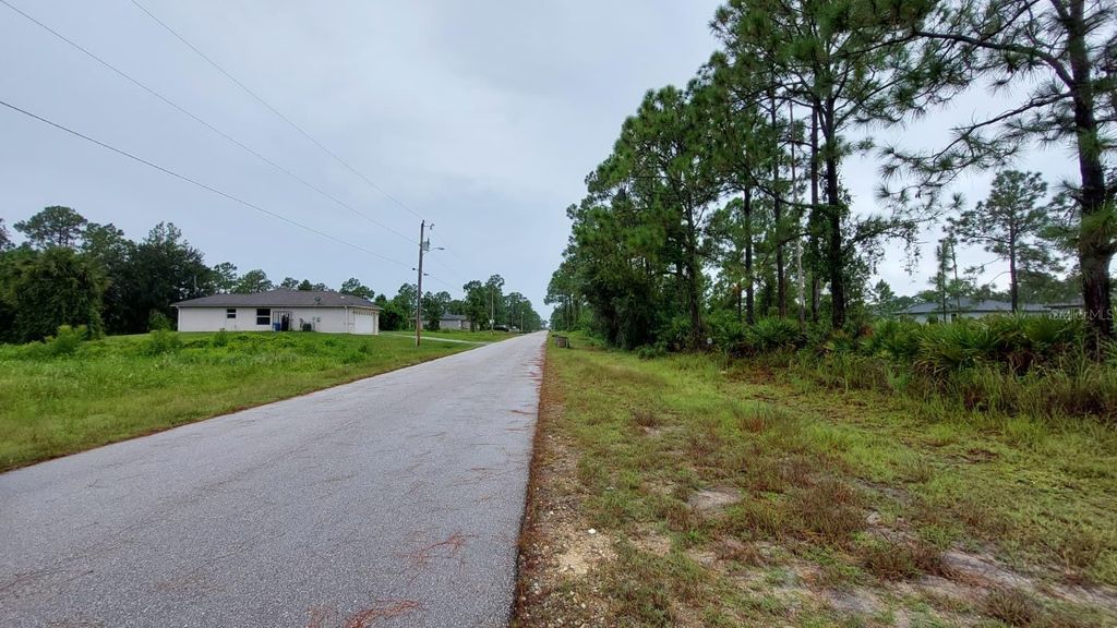 Photo of 1153 Dutchess Street E, Lehigh Acres, FL 33974 (MLS # O6338728)