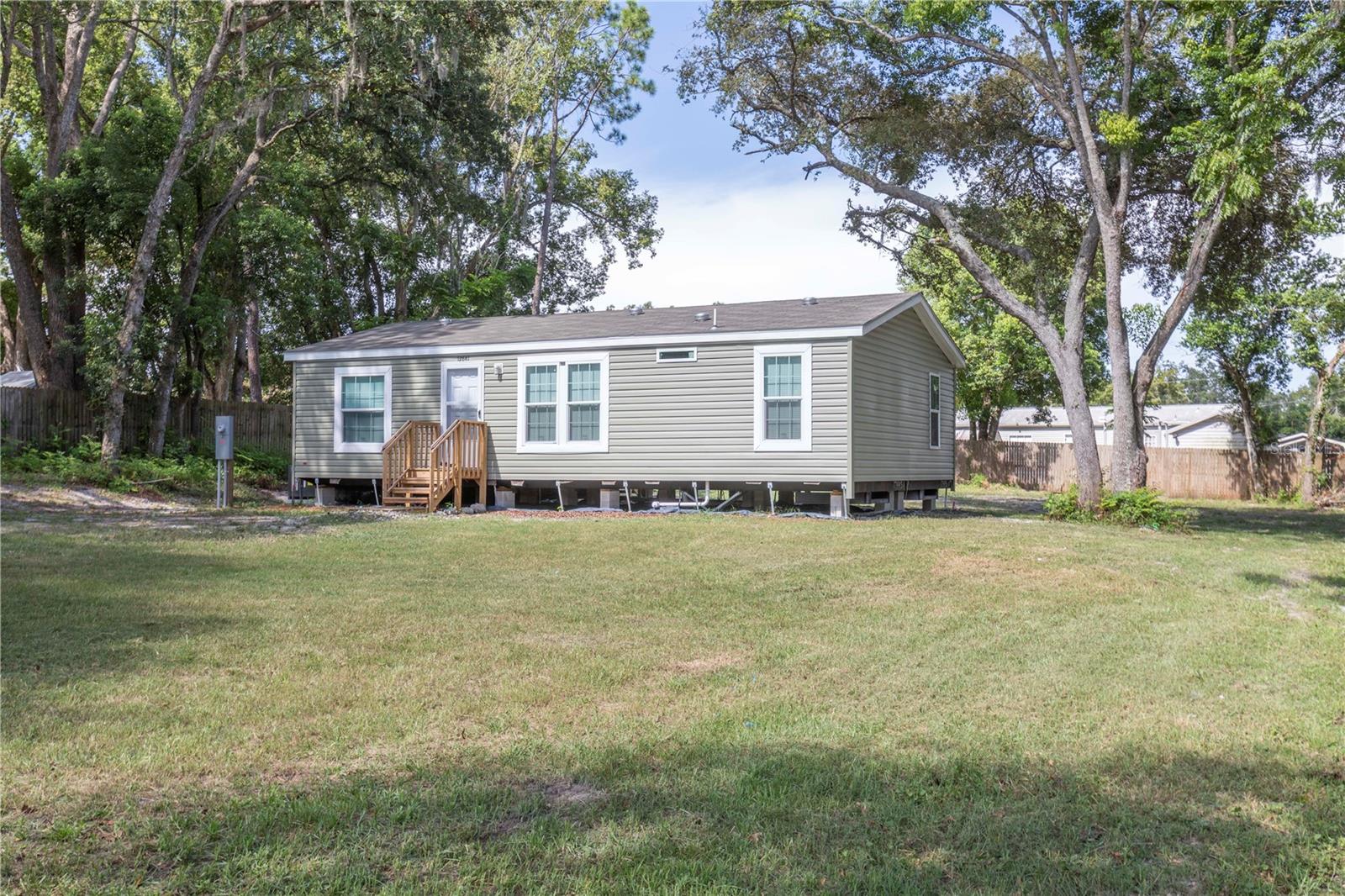 Welcome Home! This Brand new 2025 3-bedrooms/2 baths Manufactured Home is built to fit your needs. Built on an oversized 0.4-acre lot, it features a good size master bedroom with a walk-in closet and en-suite bathroom. It has a nice open floor living room and a kitchen with a snack bar and dinning space. The home also features a washer and dryer area inside the home for your everyday convenience. It offers ample parking in the front and back of the property. Septic tank is at ground level for peace of mind. Home is connected to public water, but there is a well in the property, also. Located just minutes from shopping, dining, beautiful Gulf Coast Beaches, entertainment, and main highways. No HOA/CDD! Schedule your viewing today to see firsthand all the features this beauty has to offer!