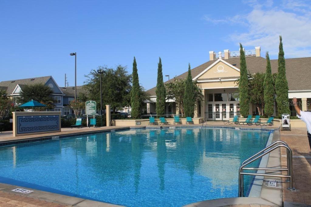 Photo of 2211 San Vittorino Circle #102, Kissimmee, FL 34741 (MLS # O6447404)