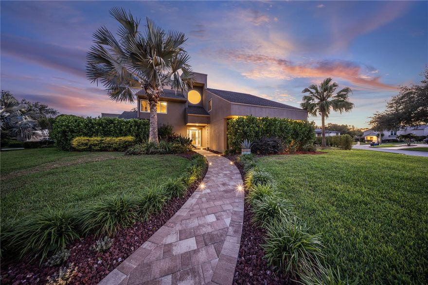 Explore the epitome of luxury living in this stunning four-bedroom, three-bathroom home nestled in the sought-after Carrollwood neighborhood, set on an expansive corner lot. Every aspect of this residence embodies sophistication and comfort, offering an ideal sanctuary for your family.

Step inside to find an airy layout highlighted by a wood-burning fireplace in the living room. The spacious kitchen, complete with a generous island, is ideal for family gathering. Endless natural light with unforgettable sunrise views in the glass dome breakfast nook. This home is protected by Pella hurricane-impact windows and sliding glass doors, offering peace of mind.
The outdoor space features a heated saltwater pool, accompanied by an enchanting waterfall and fire pit, creating a warm environment for relaxation and entertainment. The outdoor kitchen and grill are perfect for culinary enthusiasts, while a 180in screen outdoor projector provides a delightful setting for movie nights. A peaceful Koi pond enhances the tranquility of the outdoor area, all beautifully enclosed by a two-story cage.

The primary bedroom, located on the first floor and overlooking the serene Koi pond and pool, is a luxurious retreat featuring a three-sided electric fireplace that adds warmth and ambiance. Additionally, the room includes a motorized TV mount, allowing you to move the TV in any direction with the convenience of a remote control. The spa-like en-suite bathroom boasts a freestanding tub positioned to offer captivating views of the Koi pond and pool, providing a perfect spot for relaxation. The impressive shower room, which includes a unique shower bed, includes dual showerheads and body jets for ultimate rejuvenation.

In front of the dining area, there is a stylish wet bar, providing an ideal space for serving drinks during meals or entertaining guests, making your dining experiences even more special.

The Florida room features a stunning zero corner door that seamlessly connects the indoor and outdoor spaces, providing an inside-outside feel. It includes a captivating ceiling-to-floor waterfall that elegantly overlooks the living room, enhancing the serene atmosphere and promoting relaxation throughout the home.

For added convenience, a dedicated den/study offers a peaceful workspace, with floor-to-ceiling glass walls that foster a bright and motivating environment. The wine cellar is thoughtfully placed in the home, providing easy access for entertaining.

Upstairs, three additional bedrooms and a full bath ensure ample space for family and guests. The property is further enhanced by a beautifully paved driveway and walkway that accommodates up to ten vehicles, complete with built-in lighting to illuminate your approach.

This Carrollwood retreat offers an extraordinary lifestyle brimming with comfort, luxury, and convenience. Schedule your private tour today and experience the elegance firsthand!
