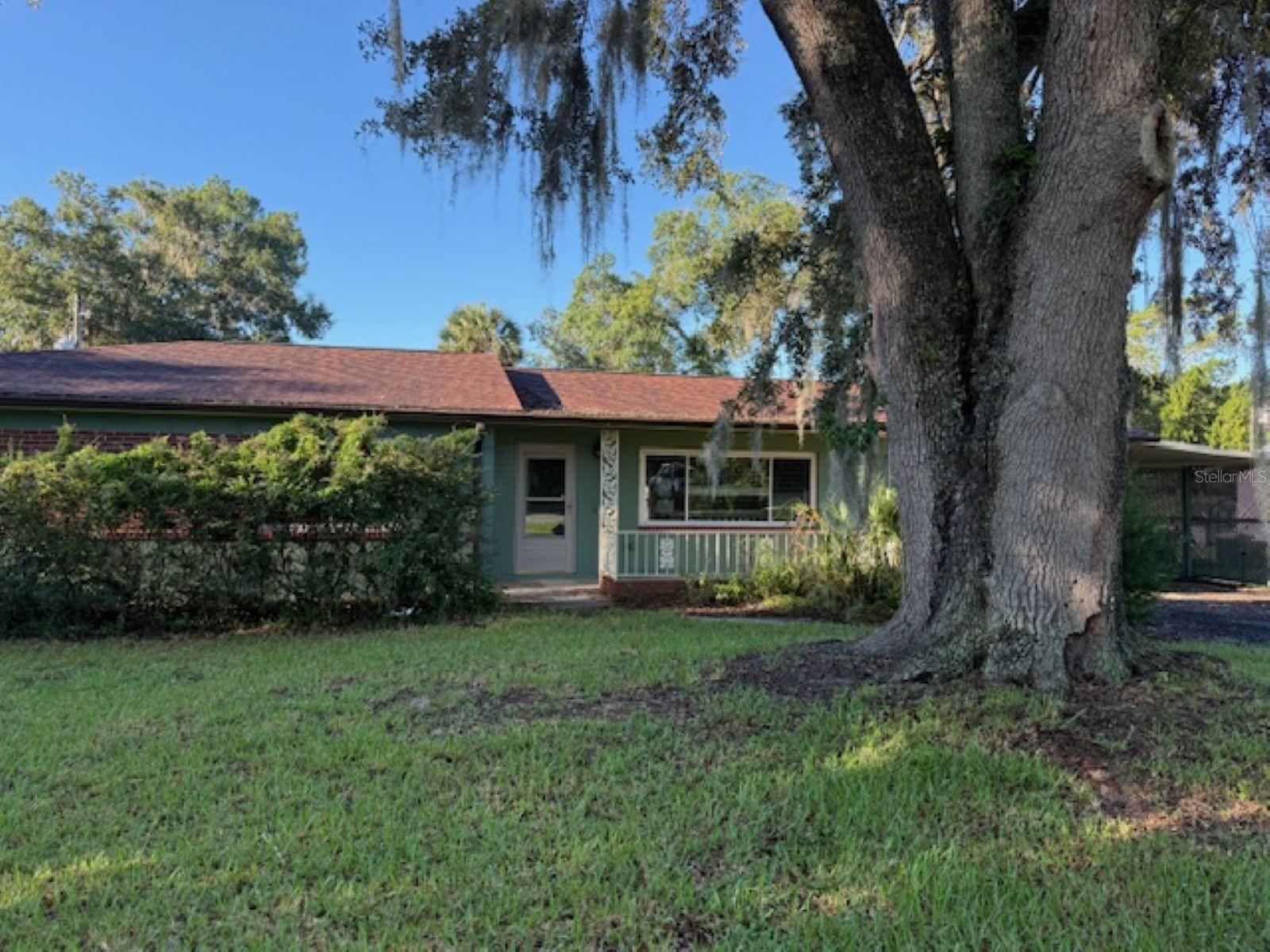 This beautiful 3 bd/2ba home is located near the heart of Ocala and offers you the convenience of being close to everything Ocala has to offer. It features wood laminate flooring in a spacious living room that opens to kitchen, dining and even a Florida Room! The master bedroom has a gorgeous cedar wood walk-in closet as well as a built in closet! It is not just spacious inside but also includes 2 large storage sheds. It could use some TLC but has endless opportunities at a terrific price. This one is a must see!