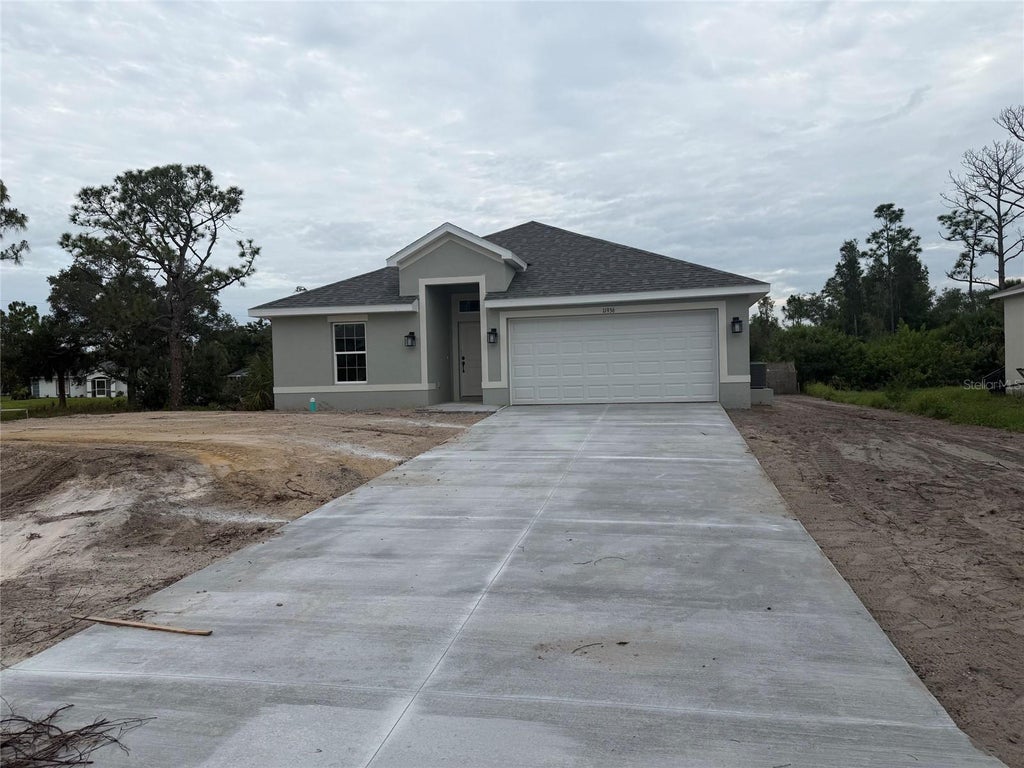 Photo of 11936 Booth Avenue, Port Charlotte, FL 33981 (MLS # C7529259)