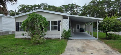 Photo of 315 Papaya Circle, Barefoot Bay, FL 32976 (MLS # L4956324)