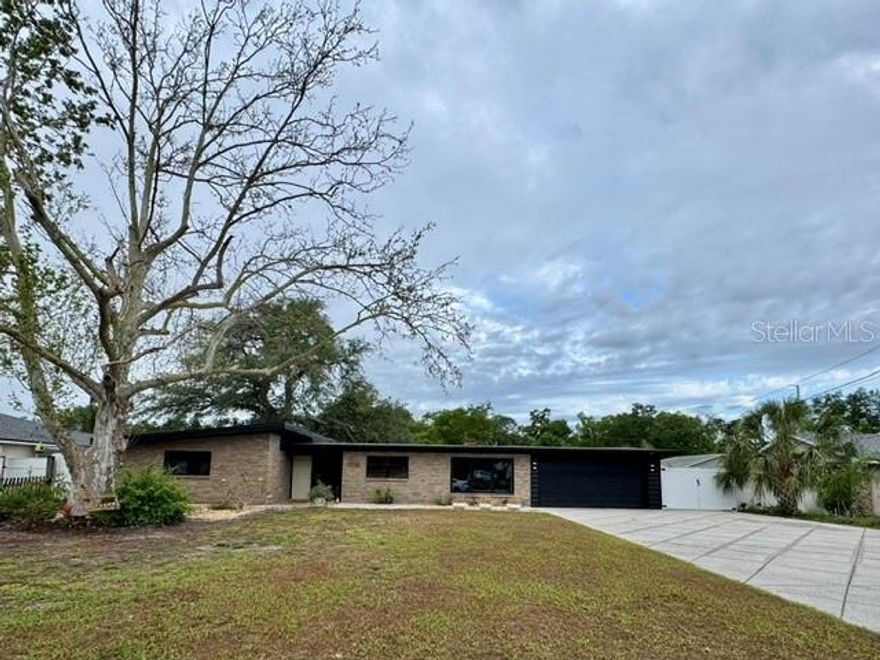 Full of charm and distinctive character, this beautifully updated 3-bedroom, 3-bathroom residence offers a seamless blend of style and functionality. Thoughtfully renovated throughout, the home features a stunning, fully remodeled kitchen with modern finishes, complemented by three updated bathrooms designed with both elegance and comfort in mind. At the heart of the home, the family room makes a bold statement with a dramatic fireplace, while the living spaces are elevated by exposed beams and a vaulted ceiling in the living room, creating an open, airy feel filled with architectural interest. An additional flexible space provides the ideal setting for a home office, den, or creative retreat. Step outside to your private oasis, where a screened-in saltwater pool is paired with an expansive lanai—perfect for hosting gatherings or enjoying Florida living year-round. The pool includes a child safety fence with two gates for your convenience. The backyard also features a large two-story shed, offering ample storage or workspace. Additional peace of mind comes with a new roof, adding both value and longevity to the home. Ideally situated in a prime Tampa location, this home offers convenient access to top-rated dining, shopping, major highways, and everything the Tampa Bay area has. With its unique character, stylish upgrades, and versatile layout, this home offers a truly exceptional living experience. NO HOA! Boat or RV Parking allowed!