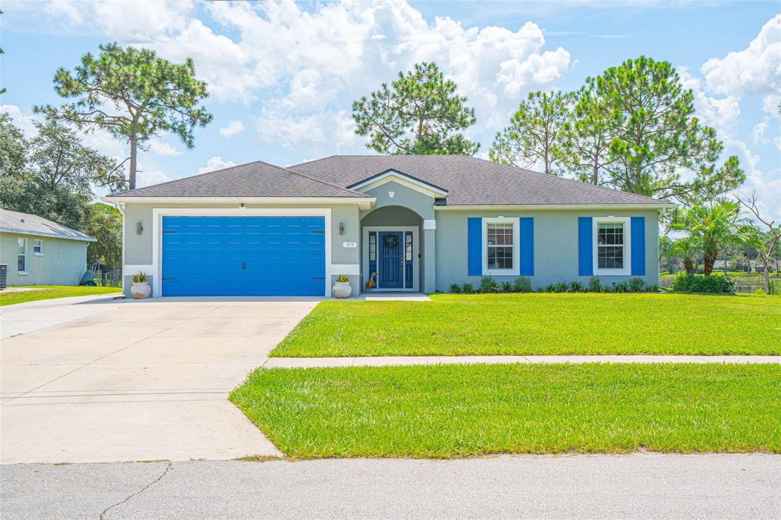 This beautifully maintained 3BD/2BA home, built in 2018, offers LAKE VIEWS & ACCESS, NO HOA, and sits on an oversized .34-acre lot in the desirable Deltona Lakes community. Step inside to find a bright and airy interior featuring neutral wall tones, wood-look tile floors, crown molding, and abundant natural light.
The open floor plan seamlessly connects the living, dining, and kitchen areas—perfect for entertaining. The gourmet kitchen is a chef’s dream, complete with granite countertops, stainless steel appliances, tiled backsplash, 42” premium cabinets with under-cabinet lighting, and a spacious island.
The primary suite is generously sized and showcases peaceful lake views, a walk-in closet, and a spa-inspired en-suite with dual sinks, a soaking garden tub, and a separate shower. Two additional bedrooms share a stylishly updated guest bathroom.
Enjoy Florida living outdoors with an extended patio overlooking the lake—ideal for gatherings or watching the sunset. With a backyard this large, there’s room to add a pool, garden, or simply enjoy the tranquil water views. A large storage shed, exterior solar lighting, and a 2-car garage with epoxy flooring add convenience and functionality.
Deltona offers the best of Central Florida—less than 30 minutes to the beach, close to lakes, springs, and parks, and just a short drive to Deland, Sanford, Lake Mary, shopping, dining, and more.
This move-in ready home blends modern comfort with a serene lakefront lifestyle—don’t miss the chance to make it yours!