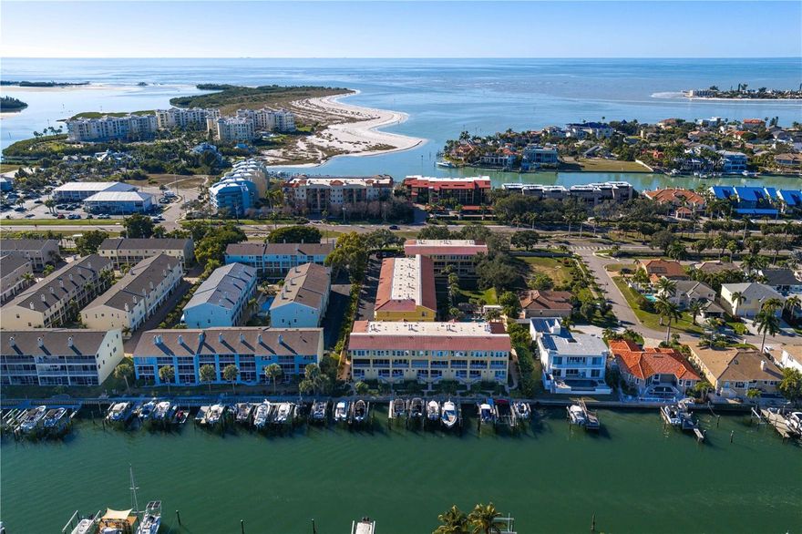 Exquisitely renovated luxury waterfront townhouse offering three bedrooms, three full baths, plus an additional half bath powder room, every inch thoughtfully redesigned with uncompromising attention to detail. This residence has been completely transformed into a sophisticated, contemporary retreat where everything has been touched. The gourmet kitchen features marble countertops, Bosch appliances, contemporary lighting, and wide-plank white oak wood flooring throughout. The living room is highlighted by a bio-ethanol fireplace and new hurricane-impact windows and sliders throughout. All bathrooms have been completely renovated with luxury appointments, including quartz countertops, oversized mirrors, and spa-inspired finishes. The primary bath features a freestanding soaking tub, while the powder room is a jewel box with a marble counter and natural Nganjuk onyx sink. Enjoy an oversized 15.5-ft private boat slip, 12,000-lb boat lift, and no fixed bridges to the Gulf. Additional features include a two-car tandem garage and central vacuum system.
Community amenities include a heated and cooled pool. HOA includes water, sewer, trash, cable TV, and internet. Conveniently located just 10 minutes to St. Pete beaches and Fort DeSoto Park, close to great local restaurants and shopping, and approximately 30 minutes to Tampa International Airport.  This is a rare opportunity to own a luxury waterfront townhouse combining modern renovation, premier boating access, and an exceptional coastal lifestyle.