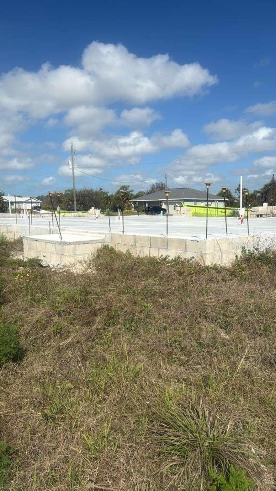 LOCATION!!! Build your dream home in an unbeatable setting. This prime lot is just minutes from beautiful beaches, golf courses, shopping, and dining. A public boat ramp with access to the Gulf of Mexico is only a few miles away, and public water and sewer connections are available.
Located in the highly desirable community of Rotonda Sands, this property is surrounded by well-maintained homes and ongoing new construction. The lot is cleared, with electricity available, making it ready for your future home.
Even better, significant savings already in place! The lot includes an existing slab and stem wall, helping you save time and construction costs. Approved plans are also available, allowing you to complete a thoughtfully designed home featuring 4 bedrooms, 2 bathrooms, a 2-car garage, 1,664 sq ft under air, and 2,113 total sq ft. Enjoy a peaceful, relaxed setting while still being close to top-rated shopping, schools, beaches, and more.. Motivated seller, don’t miss this opportunity! This one won’t last!