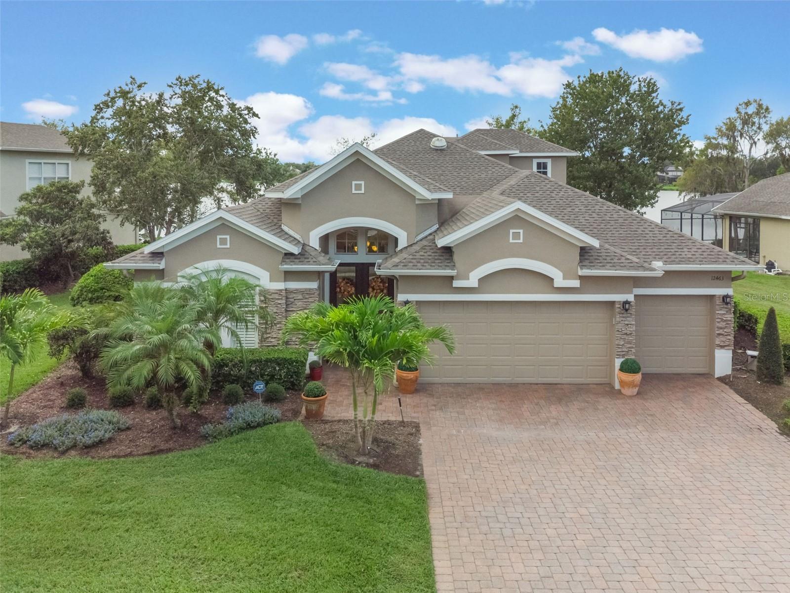 Rare Lakefront Gem in Highly Sought-After Westfield Lakes!
This is your chance to own a stunning lakefront pool home in the desirable Westfield Lakes community! Beautifully maintained and tastefully updated, this spacious 4-bedroom, 3-bath home also features an upstairs bonus room—perfect for a home office, media room, or guest retreat.
From the moment you arrive, you’ll be captivated by the lush landscaping, brick paver driveway, and three-car garage. Step through the elegant stained glass double entry doors into a light-filled, split floor plan with luxury light wood vinyl plank flooring and plantation shutters throughout.
The formal living and dining rooms offer sophisticated spaces for entertaining, while the heart of the home—the gourmet kitchen—was completely updated in 2018 and boasts double ovens, electric cooktop, microwave, designer pendant lighting, custom backsplash, and an oversized Cambria granite island that comfortably seats 8. The kitchen opens to a bright and inviting family room featuring a custom built-in entertainment center and electric fireplace.
Enjoy peaceful lake views from the extended master suite, complete with tray ceiling and private seating area. The fully remodeled spa-like master bath (2023) offers a Roman tub, gorgeous walk-in shower, and dual sinks. The thoughtfully designed layout ensures privacy, with the second bedroom featuring an ensuite bath and pocket door, while bedrooms 3 and 4 are located at the rear of the home and share a third full bath. Bedroom 4, with double doors and lake views, is ideal for guests or a home office.
Upstairs, the bonus room with double windows overlooking the lake provides even more flexibility.
Step outside through French doors to your private lakefront oasis—a solar-heated pool and spa surrounded by an expansive brick paver patio, ideal for dining, relaxing, and entertaining.
Located on Lake Beulah, an 18-acre natural spring-fed lake, this home offers tranquil views, non-motorized water activities, and an abundance of natural wildlife. Westfield Lakes features two community fishing docks, tennis courts, and two playgrounds.
Additional highlights include:
• New roof (2021)
• New A/C units (2020)
• Numerous updates throughout including new fans, designer lighting, and fixtures
Prime location—just minutes to Winter Garden Village, charming downtown Winter Garden, top-rated schools (West Orange High School across the street), and with easy access to all major highways, theme parks, and Central Florida attractions.
? This is a true must-see lakefront paradise—schedule your private tour today! ?