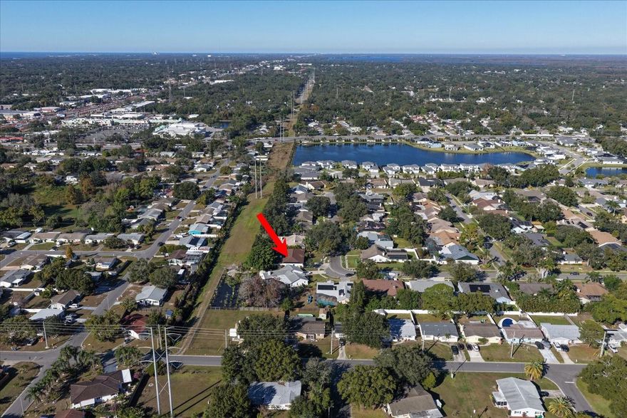 Welcome to this beautifully updated family home located in the highly desirable Trails of Countryside neighborhood. This spacious split-floor-plan residence offers 4 bedrooms, 2 baths, and a 3-car garage, thoughtfully designed for both everyday living and entertaining.

The heart of the home features a remodeled kitchen with granite countertops, wood cabinetry, stainless steel appliances, and a brand-new stove, opening seamlessly to a light-filled family room with a cozy wood-burning fireplace and serene backyard views.

The primary suite has been enhanced with a newly updated bath, while the second bathroom features a new bathtub. Luxury vinyl flooring has been installed in the bedrooms and the living and dining areas, as well as the bathrooms, creating a modern, durable, and cohesive feel throughout the main living spaces. Recent improvements include a new roof (2023), new lights and ceiling fans in every room (2023), a new digital water softener (2025), updated sprinkler system (2024–2025), completed stucco repairs, and fresh exterior paint, offering peace of mind and strong curb appeal.

Step outside to the screened pool and outdoor living area—ideal for entertaining or unwinding—featuring pavers, a covered lanai, and an updated koi pond with new fish, creating a tranquil backyard oasis.

Conveniently located in the Countryside area of Clearwater, this move-in-ready home is close to shopping, dining, beaches, and airports. A wonderful opportunity to own a thoughtfully updated home in one of Clearwater’s most sought-after communities.