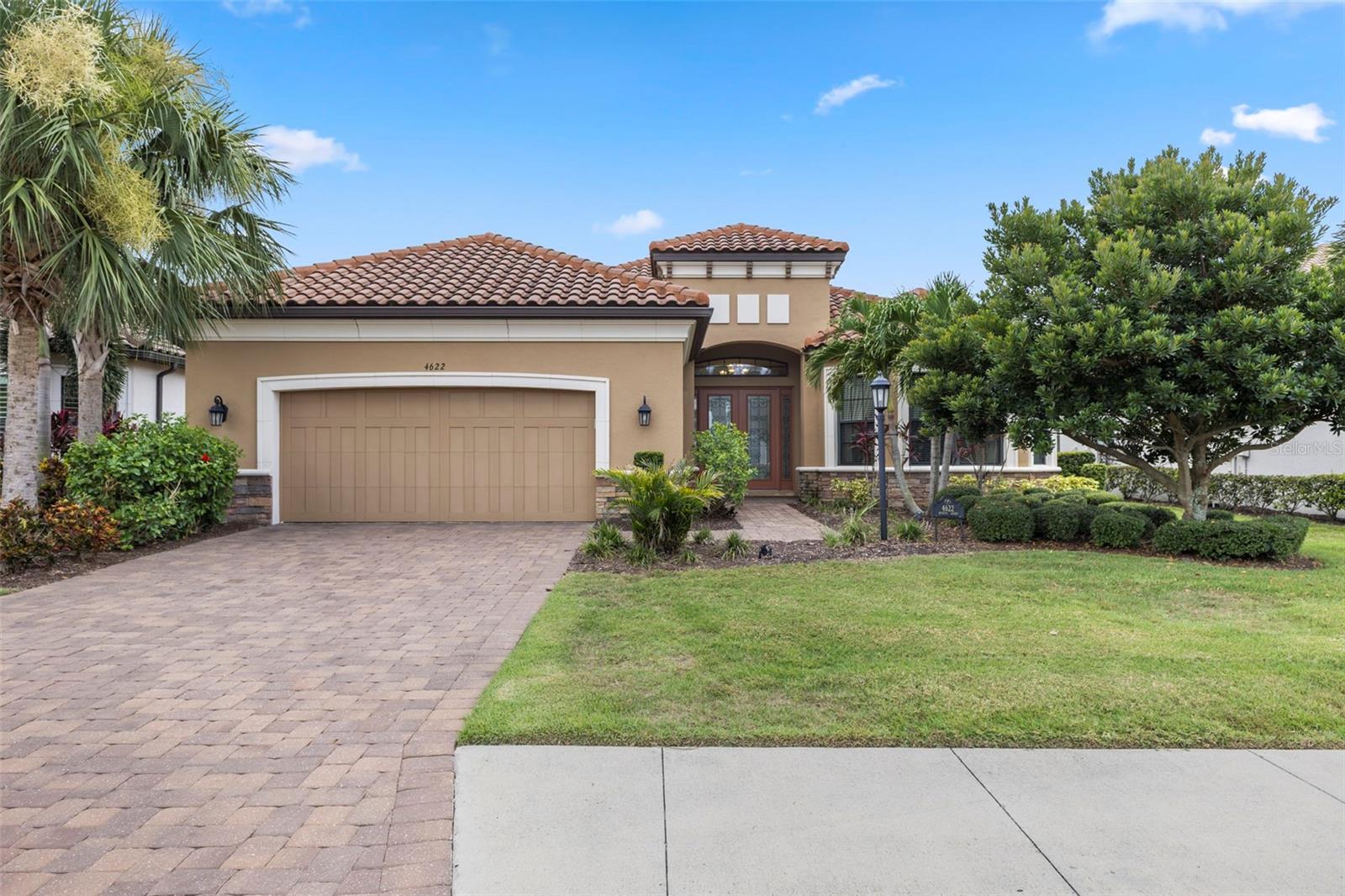 Welcome to 4622 Benito Ct, an exceptional opportunity to own a stunning golf-deeded home in the highly sought-after Esplanade Golf & Country Club in Lakewood Ranch. This beautifully designed residence offers 3 bedrooms, 3 bathrooms, and over 3,100 square feet of luxurious living space, perfectly blending elegance, comfort, and a resort lifestyle.From the moment you step inside, you’ll be captivated by the light-filled interiors and expansive views of the lush golf course. The bright and airy kitchen is the heart of the home, featuring premium cabinetry, sleek countertops, and stainless-steel appliances. A large island and open-concept design make it ideal for both casual meals and entertaining. Picture yourself preparing dinner while enjoying breathtaking vistas of rolling fairways just beyond your windows.The spacious primary suite is a true retreat, offering tray ceilings, walk-in closet, and a spa-inspired en suite bathroom with a large walk-in shower and dual vanities. Two additional bedrooms, each with access to full bathrooms, provide privacy and comfort for family or guests. A versatile den or office space adds flexibility to suit your lifestyle.Step outside to the screened lanai and experience the ultimate Florida lifestyle. Whether sipping your morning coffee or hosting evening gatherings, the serene golf course backdrop creates an inviting outdoor oasis. There’s ample space to add a custom pool if desired, making this home as functional as it is beautiful. As a golf-deeded property, this home includes unlimited golf for two people, providing year-round access to Esplanade’s championship 18-hole course. Beyond the greens, the community is rich with resort-style amenities designed to elevate your daily living. Residents enjoy a luxurious clubhouse with a full-service restaurant and bar, a resort-style pool, spa, and cabanas, state-of-the-art fitness center, and wellness programs. Sports enthusiasts will love the tennis, pickleball, and bocce courts, while walking trails and dog parks enhance the vibrant neighborhood experience.Esplanade’s social calendar is second to none, offering planned events, cooking classes, and live entertainment to help residents connect and enjoy the best of community living. With full lawn maintenance included, you can truly embrace the lock-and-leave lifestyle. Located in the heart of Lakewood Ranch, you’re just minutes from fine dining, shopping, medical facilities, and the beautiful beaches of Sarasota and Anna Maria Island. Easy access to I-75 means you’re a short drive from Sarasota-Bradenton International Airport and all that the Gulf Coast has to offer. Don’t miss your chance to live in one of Lakewood Ranch’s most prestigious golf communities. Schedule your private showing today and discover why 4622 Benito Ct is more than a home—it’s a lifestyle.