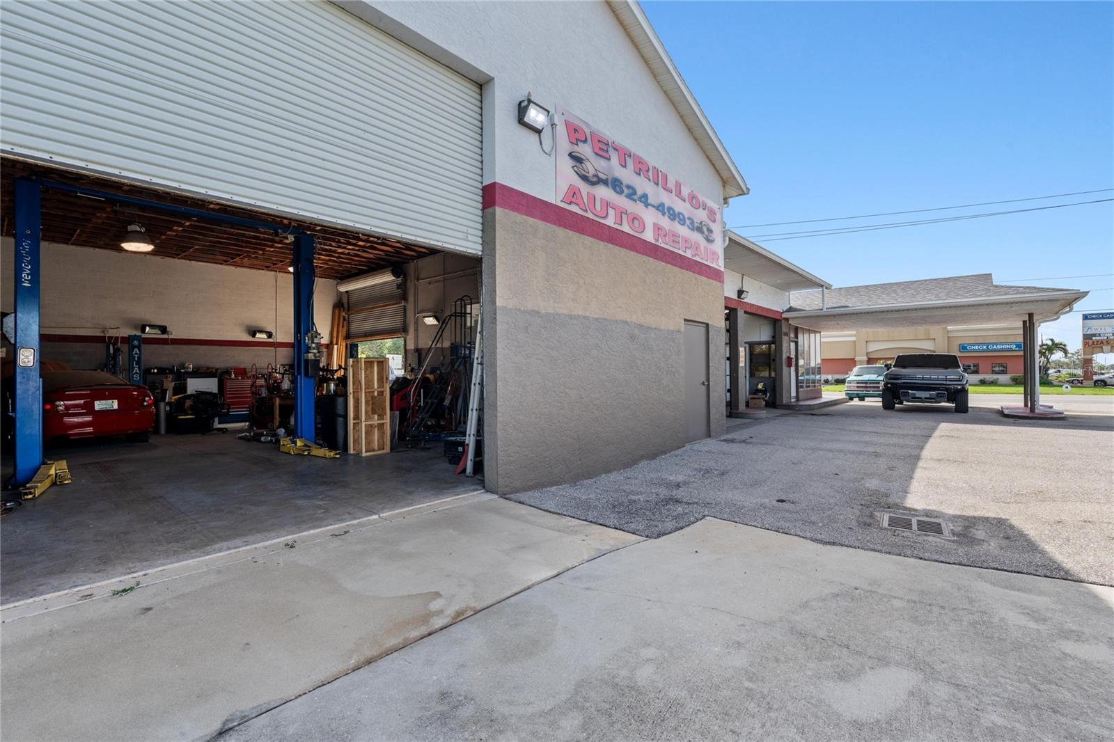 Exceptional Auto Repair Business & Commercial Property – Port Charlotte, FL
A rare opportunity to acquire a well-established auto repair business situated in the heart of Port Charlotte’s booming growth corridor. Family-owned and operated since the 1990s, this property has witnessed decades of transformation and success — and now, it's ready for its next chapter.
Strategically located on a high-visibility corner lot with Commercial Intensive zoning, this property offers unmatched exposure and versatility for a wide range of automotive and commercial ventures.
Property Highlights:
* Prime Commercial Intensive Zoning
* High-traffic corner location with excellent visibility
* Two 16-foot and two 10-foot overhead doors
* Four professional-grade auto lifts
* Oversized service bay ideal for motorhomes and large vehicles
* Ample workspace and customer parking
Business Highlights:
* Established, reputable auto repair center with loyal clientele
* Owners willing to provide hands-on transition support and share proven business strategies
* Significant upside potential through Turo rentals, fleet services, used car sales, and more
This is more than just a business — it’s an opportunity to invest in a piece of local history while capitalizing on the explosive growth in one of Southwest Florida’s most desirable commercial markets.
Whether you’re an experienced operator, investor, or entrepreneur, this turnkey operation offers multiple income streams, excellent infrastructure, and the support to help you succeed from day one. Schedule your private tour today!