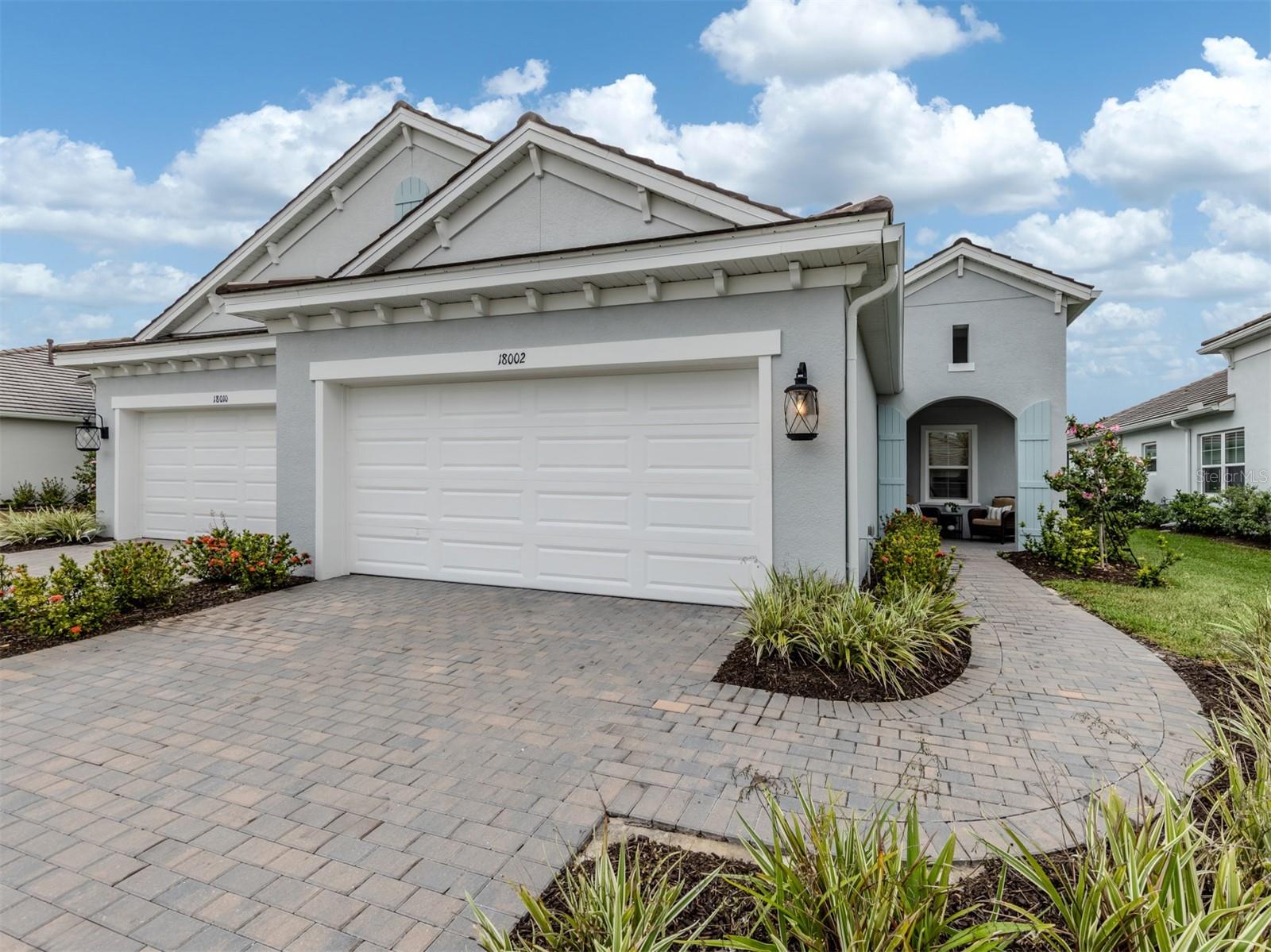 Skip the wait - You're Dream Florida Villa is Ready NOW! Why go through the hassle of building when you can move right into this pristine, like-new 2023 villa in the highly desirable Wysteria at Wellen Park? Tucked away on a peaceful cul-de-sac, this stylish and meticulously maintained home is packed with thoughtful upgrades and modern conveniences—so you can start enjoying the Florida lifestyle from day one.
From the moment you step inside, you’ll be welcomed by an open, airy layout filled with natural light. The gourmet kitchen is a true showstopper, featuring Calacatta Novella quartz countertops, GE stainless steel appliances, a gas stove, pot/pan drawers, and upscale finishes that elevate everyday cooking and entertaining. Custom tile flooring flows throughout the home, while designer lighting and ceiling fans add the perfect finishing touch. The spacious primary suite offers tranquil views of lush Florida landscaping and a spa-inspired en-suite bath with dual vanities, walk-in shower, and private water closet. A separate guest wing provides privacy and comfort for visitors, and the versatile den/flex room is ideal for a home office, hobby space, or cozy retreat. Enjoy added peace of mind with impact windows and doors, energy-efficient tilt-in cleaning features, and no flood insurance requirement. Step outside to your extended screened lanai—complete with a gas stub, perfect for grilling or designing your dream outdoor kitchen. Wysteria residents enjoy resort-style amenities including a pool and spa, pickleball courts, and a covered pavilion—all included in your HOA, along with lawn care, irrigation, cable, and internet. Located just minutes from Downtown Wellen Park, CoolToday Park, shopping, dining, and some of Southwest Florida’s most beautiful beaches, this golf-cart-friendly community makes it easy to live, relax, and explore. This move-in-ready villa is the total package—don’t miss your chance to see it in person. Schedule your private showing today!