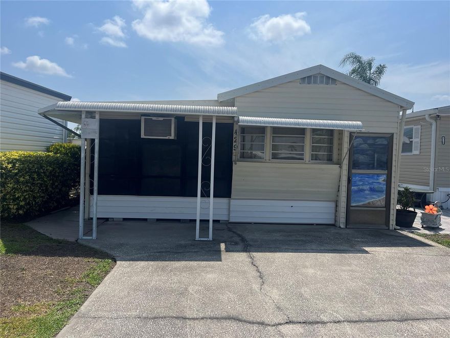 Wonderful opportunity to own your mobile home by the canal in the desirable Outdoor Resorts community!  This one-bedroom, one-bath home offers peaceful water views and the chance to unwind in a serene setting. Enjoy  relaxing evenings by the canal in a friendly, well-maintained community with great amenities. You will find a wonderful Cabinet bed for an extra sleeping option, along with a sofa bed in the living room-providing plenty of comfortable places to sleep. The HOA is $691 quarterly and includes: Water, Sewer Maintenance, Cable, Trash, Lawn care, 24Hr security, and resort -style amenities like two heated Pools, 9-hole golf, Tennis & Pickleball courts, and access to Lake Davenport for Boating and Fishing enthusiast. Best of all You Own the Land!