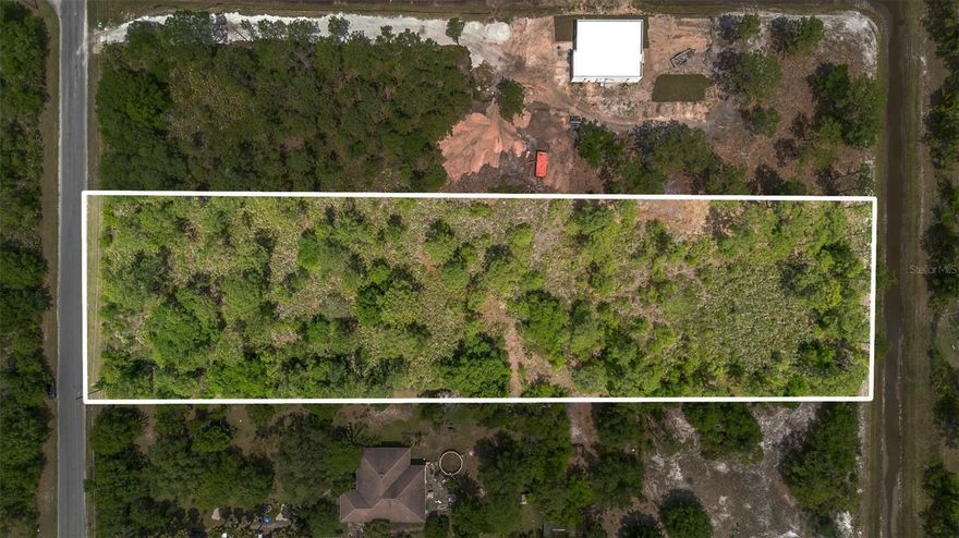 Come build your DREAM HOME! Located in the sought-after golf and equestrian community of Wedgefield, this offering includes two side-by-side lots totaling 2.16 acres. The lots must be sold together, as the minimum required frontage to build is 105 feet. This growing community offers an enhanced lifestyle with a variety of amenities, including a newly built K-8 Wedgefield School, a clubhouse with restaurant, picnic pavilion, skate park, and sports courts. Residents also enjoy access to the expansive 9,300-acre Hal Scott Preserve along the Econlockhatchee River, ideal for hiking, dirt biking, and horseback riding.  Conveniently located between SR 528 and SR 520, with easy access to Orlando International Airport, the beaches, Port Canaveral, and Lake Nona’s Medical City.