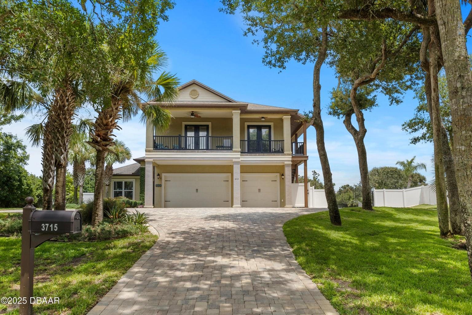 Rare opportunity to own approximately 1.3 acres on prestigious John Anderson Drive in Ormond Beach. This estate includes a 0.4-acre riverfront lot with riparian rights and a two-year-old dock featuring a covered electric boat lift on the Intracoastal Waterway, as well as a 0.9-acre lot with a spacious 4-bedroom, 4-bath residence and a 3-car garage. There is ample space for all your toys, including boats, jet skis, and RVs. Step through the beautiful front door into a welcoming foyer where you are immediately greeted by scenic views of the sparkling screened pool and lush backyard. Inside, the home boasts vaulted ceilings, granite countertops throughout, stainless steel appliances, a large walk-in pantry, and elegant 18x18 porcelain tile in the main living areas. The expansive master suite offers a large walk-in closet and a luxurious bathroom, while the private second-story retreat features its own entrance, bedroom, full bath, living area, and kitchenette—perfect for guests,
in-laws, or a private office. Enjoy a morning coffee from the upstairs balcony as the sun rises, spend quiet afternoons lounging by the solar-heated pool overlooking the trees in complete privacy, or take in breathtaking sunsets from your private dock on the Intracoastal. The fully fenced backyard offers a tranquil, secluded escape, complete with a tanning shelf, bench seating in the pool, and an outdoor shower.
This home can be purchased fully furnished, making it an effortless choice whether you're seeking a primary residence or a ready-to-enjoy vacation retreat. With brand new A/C units, an elevation of 15 feet above sea level and no flooding history, and a location within walking distance to the beach, this property blends comfort, convenience, and luxury. Priced below market value, it's a rare chance to live the Florida lifestyle you've been dreaming of.