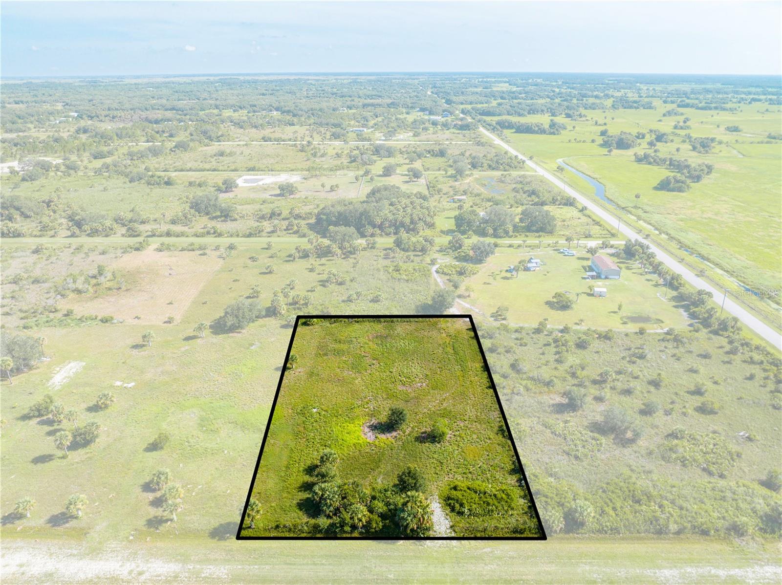 Dream big on your own land in Florida.
This 1.25 acre high and dry vacant lot in Okeechobee is a rare opportunity for any kind of buyer.
Whether you are looking to build your dream home, start a mini farm, invest in Florida land, or just
have a peaceful retreat to escape the city. With no HOA, no time-to-build restrictions, and zoning that
opens the door to multiple possibilities, the freedom is yours. Picture yourself surrounded by nature,
under wide open skies, with room to grow, play, or relax. Located just minutes from Lake Okeechobee
and within reach of major routes, this is a rare find.
