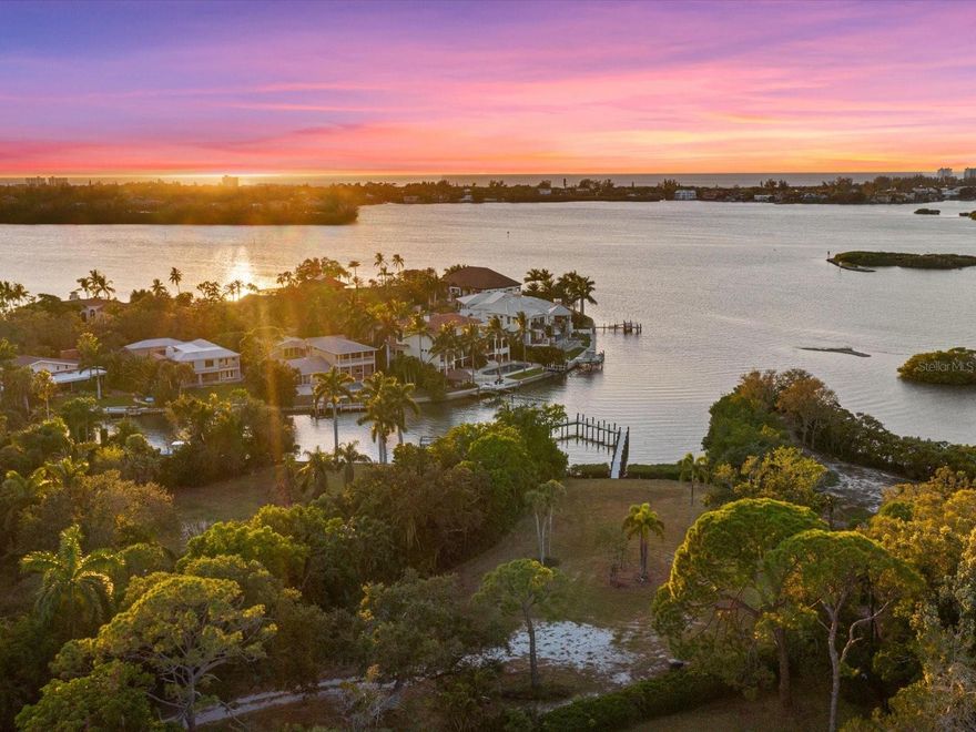 Nestled in Sarasota's highly coveted West of Trail neighborhood, Oyster Bay, this one acre cleared waterfront lot presents a rare opportunity for an ideal location to build a waterfront home. With 148 feet of water frontage along the intracoastal waterway, this property offers a blank canvas to design and create a home that embodies your lifestyle. Boating enthusiasts will appreciate the brand new oversized dock, featuring composite decking and stylish metal wire railing. Perfect for welcoming boating guests, fishing or simply enjoying breathtaking sunset views. This prime location provides the tranquility of waterfront living while only being a ½ mile away from the centerpiece of this neighborhood, The Field Club, where neighbors can gather to be a part of everything this neighborhood has to offer. Additionally, being minutes away from the cultural arts scene in downtown Sarasota this property is a mere 0.8 miles, by boat, to the North Siesta Key Bridge providing access to the pristine shores of Siesta Key, Lido Key, downtown Sarasota and Longboat Key. Families will also appreciate its proximity to Phillippi Shores Elementary (1.4 Miles), Brookside Middle School (2.0 Miles) and Riverview High School (2.1 Miles). Everyday amenities from grocery stores, coffee shops, gyms, shopping and an array of restaurants are located minutes away, making this a rare opportunity to create your own waterfront masterpiece in a well-known and established neighborhood West of Trail in Sarasota. House plans for a modern 4 bedroom, 4 full bathroom, 2 half bathroom, 6,515 square foot house have been designed and are included in the sale of property. The breathtaking water views can be enjoyed at ground level and the entire bay will be seen from the future first floor.