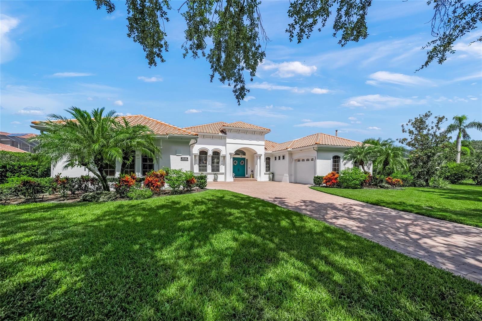 This is the one * WELCOME TO THE FOUNDERS CLUB, ONE OF THE MOST COVETED COUNTRY CLUB COMMUNITIES IN SARASOTA * This Quality Built Lee Wetherington Executive Home features a VERY PRIVATE SETTING ON OVER 1/2 ACRE * PANORAMIC VIEWS OF A TRANQUIL LAKE IN YOUR BACKYARD WITH SERENE GREENBELT VIEWS FROM YOUR FRONT YARD - THIS IS A PREMIER LOCATION * RARELY AVAILABLE in this sought after neighborhood, this BEAUTIFUL HOME has been LOVINGLY RENOVATED * Step into the Grand Foyer and be amazed * Architectural details are at every turn * The current homeowners painstakingly oversaw every step of the NEW CHEF'S KITCHEN WITH A COASTAL CONTEMPORARY DESIGN BOASTING NEW Custom Wood Cabinets, NEW Quartz Countertops, a Waterfall Island, NATURAL GAS COOK-TOP and a Walk-in Pantry * The Kitchen is open to the SPACIOUS Family Room AND an expansive Glass-enclosed A/C Cabana-style Room with three walls of glass sliders (open the doors in the winter time!), screen windows, a natural gas fireplace, plus a wet bar - this is the perfect space for relaxing, entertaining, and it can even be used as a playroom * This FAMILY ESTATE is remarkable with 5,426+/- A/C SQFT * 4 Bedrooms & 4.5 Baths * Den/Office * Bonus Room * A Multi-use 15x13 Safe Room could be used as a Home Gym or Flex-space * Your Primary Suite features #2 Custom California style Walk-in Closet's and a NEW LOVINGLY RENOVATED Spa-style Bath with custom Cabinets, NEW Garden Tub, and a SPACIOUS Walk-in shower * This THOUGHTFULLY CURATED BATH is a TRUE OWNERS' RETREAT * Formal Living Room * Formal Dining Room * UPSTAIRS FEATURES A BONUS ROOM AND A SEPARATE GUEST BEDROOM + BATH with a Screened Lanai featuring Lake Views * Just a few of the additional features include: Volume ceilings * IMPACT GLASS WINDOWS + STORM SHUTTERS * SOLID CORE DOOR & CUSTOM WOOD TRIM * NEW Exterior Paint 2021 * NEW Interior Paint 2022 * Whole House Water Softener and Reverse Osmosis System * A 40-kilowatt OLYMPIAN NATURAL GAS WHOLE HOUSE GENERATOR * All of this wraps the PRIVATE HEATED POOL & SPA RECENTLY UPDATED with a NEW HEATER IN 2022 AND RESURFACING WAS DONE IN 2021 * The Founders Club is a beautiful low-density 24/7 guard-gated community with over 700 acres of wetlands and preserve and only 262 homes. The renowned Robert Trent Jones Jr. golf course offers members easy tee times and is one of the only walkable courses in the region. Har-Tru tennis courts & pickle ball courts and a picnic pavilion, and playground, basketball court, and fitness center are also on site. Residents enjoy easy access to the cultural venues of downtown Sarasota and attractions of Lakewood Ranch. Optional golf/social memberships. Members enjoy a 24/7 fitness facility, stately clubhouse, community events, and a restaurant with picturesque veranda. Come see this exceptional home and discover an extraordinary lifestyle. ONE LOOK & YOU'LL FALL IN LOVE *