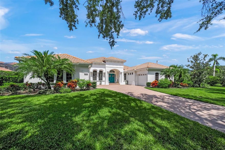 This is the one * WELCOME TO THE FOUNDERS CLUB, ONE OF THE MOST COVETED COUNTRY CLUB COMMUNITIES IN SARASOTA * This Quality Built Lee Wetherington Executive Home features a VERY PRIVATE SETTING ON OVER 1/2 ACRE * PANORAMIC VIEWS OF A TRANQUIL LAKE IN YOUR BACKYARD WITH SERENE GREENBELT VIEWS FROM YOUR FRONT YARD  - THIS IS A PREMIER LOCATION * RARELY AVAILABLE in this sought after neighborhood, this BEAUTIFUL HOME has been LOVINGLY RENOVATED * Step into the Grand Foyer and be amazed * Architectural details are at every turn * The current homeowners painstakingly oversaw every step of the NEW CHEF'S KITCHEN WITH A COASTAL CONTEMPORARY DESIGN BOASTING NEW Custom Wood Cabinets, NEW Quartz Countertops, a Waterfall Island, NATURAL GAS COOK-TOP and a Walk-in Pantry * The Kitchen is open to the SPACIOUS Family Room AND an expansive Glass-enclosed A/C Cabana-style Room with three walls of glass sliders (open the doors in the winter time!), screen windows, a natural gas fireplace, plus a wet bar - this is the perfect space for relaxing, entertaining, and it can even be used as a playroom * This FAMILY ESTATE is remarkable with 5,426+/- A/C SQFT * 4 Bedrooms & 4.5 Baths * Den/Office * Bonus Room * A Multi-use 15x13 Safe Room could be used as a Home Gym or Flex-space * Your Primary Suite features #2 Custom California style Walk-in Closet's and a NEW LOVINGLY RENOVATED Spa-style Bath with custom Cabinets, NEW Garden Tub, and a SPACIOUS Walk-in shower * This THOUGHTFULLY CURATED BATH is a TRUE OWNERS' RETREAT * Formal Living Room * Formal Dining Room * UPSTAIRS FEATURES  A BONUS ROOM AND A SEPARATE GUEST BEDROOM + BATH with a Screened Lanai featuring Lake Views * Just a few of the additional features include: Volume ceilings * IMPACT GLASS WINDOWS + STORM SHUTTERS * SOLID CORE DOOR & CUSTOM WOOD TRIM * NEW Exterior Paint 2021 * NEW Interior Paint 2022 * Whole House Water Softener and Reverse Osmosis System * A 40-kilowatt OLYMPIAN NATURAL GAS WHOLE HOUSE GENERATOR * All of this wraps the PRIVATE HEATED POOL & SPA RECENTLY UPDATED with a NEW HEATER IN 2022 AND RESURFACING WAS DONE IN 2021 * The Founders Club is a beautiful low-density 24/7 guard-gated community with over 700 acres of wetlands and preserve and only 262 homes. The renowned Robert Trent Jones Jr. golf course offers members easy tee times and is one of the only walkable courses in the region. Har-Tru tennis courts & pickle ball courts and a picnic pavilion, and playground, basketball court, and fitness center are also on site. Residents enjoy easy access to the cultural venues of downtown Sarasota and attractions of Lakewood Ranch. Optional golf/social memberships. Members enjoy a 24/7 fitness facility, stately clubhouse, community events, and a restaurant with picturesque veranda. Come see this exceptional home and discover an extraordinary lifestyle. ONE LOOK & YOU'LL FALL IN LOVE *