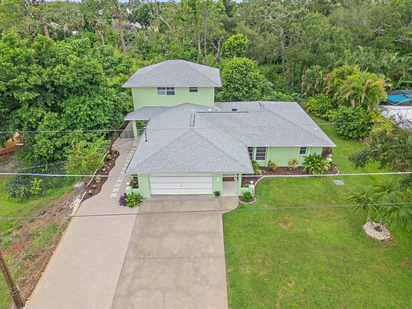 Two homes for the price of one! This charming Venice retreat has two private living areas! Both with their own private entrances, parking, laundry, and yard space!
These homes has been beautifully updated and is nestled in the heart of Venice, FL. Step inside the main home and you’ll find a bright, open living space featuring large windows, stylish finishes, and a split floor layout that flows effortlessly. The updated kitchen boasts a ton of cabinets, ample storage and counter space, and a large bar with seating, perfect for home chefs and entertainers alike. There is a Primary Suite with it's own private bathroom, a huge walk in close, and access to a large lanai. There is a second large bedroom with a walk-in closet that is located next to the nicely updated full bathroom. The main house has its own private laundry room, oversized 2 car garage, and private yard.
The in-law suite (or guest quarters) offers a private entrance, a private fenced yard, and parking which provides flexibility for multi-generational living, rental potential, or a quiet home office/studio space. The main level of the guest quarters includes a large living room with vaulted ceilings, a kitchen, a dining area, and a large lanai. The entire upstairs is a Primary Suite, with it's own Primary Bathroom, walk-in closets, and private laundry. There is a large lanai located off the upstairs Primary Suite with beautiful tropical views.
There have been numerous major upgrades include: 2023 roof, soffits & gutters, 2023 new AC, waterproof flooring and natural tile, whole house re-plumbed, new Insulation and duct work, new kitchen cabinets, kitchen countertops and sink in the kitchen, new exterior and interior paint, new lighting and fans, new landscaping, and much more. The original house was built in 1983 and the the custom solid concrete 2 story in-law suite/guest quarters was added in 2007 and updated in 2023 and 2025. FLOOD INSURANCE IS TRANSFERRABLE AT $1827 a year and the elevation is 11 feet above sea level.
Another unique aspect of the South Venice Beach neighborhood is the waterfront Community Park with boat ramp & ferry service to it's own 1300 foot deeded beach that is owned by the residents. A nominal annual fee is required to use South Venice Beach facilities. All fees are optional. Additionally, Shamrock Park is a few blocks, offering a playground, nature trail, basketball and tennis courts, and access to county-wide trails, including the renowned Legacy Trail. The convenience extends further with various amenities such as The Island of Venice, dining, shopping, medical facilities, golf, & tennis, all within a 5-minute reach. Also, the South Venice Beach Civic Association on Alligator Drive organizes intriguing events & social opportunities for the residents, enhancing the sense of community. In essence, this residence not only provides a comfortable living space but also grants you a slice of paradise, inviting you to live in perpetual vacation mode. Don’t miss your opportunity to own a truly unique property in one of Venice’s most desirable areas. Schedule your private showing today!