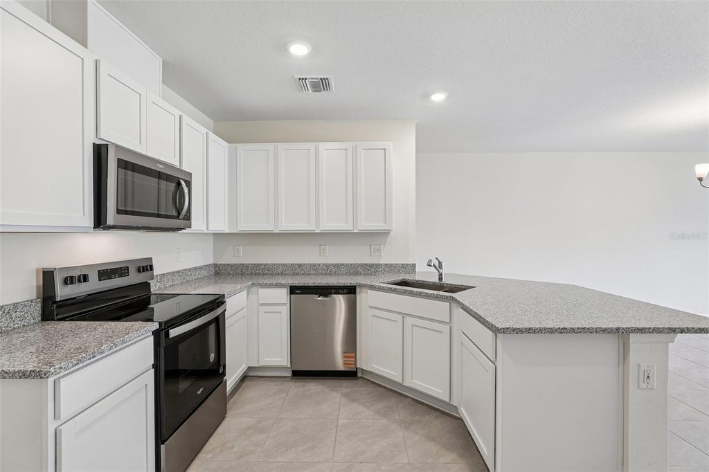 Photo of 683 Meadows Edge Place, Lake Wales, FL 33859 (MLS # O6443314)
