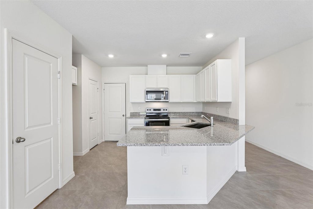 Photo of 683 Meadows Edge Place, Lake Wales, FL 33859 (MLS # O6443314)