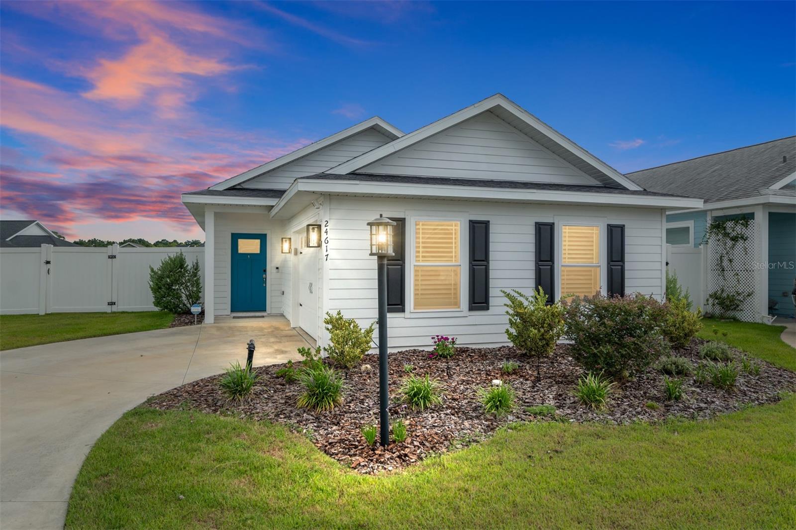 One or more photo(s) has been virtually staged. Nestled on a desirable corner lot in the heart of Newberry, this charming cottage-style 3-bedroom, 2-bath home offers the perfect blend of comfort, elegance, and modern convenience. Built in 2022, it spans 1,296 square feet of heated and cooled living space and showcases a thoughtfully designed open layout ideal for both everyday living and entertaining.
From the moment you step inside, you’ll notice the high-end finishes that set this home apart. Enjoy an open-concept layout enhanced by luxury vinyl plank flooring throughout, quartz countertops, and contemporary soft-close cabinetry in a sleek modern kitchen. Custom plantation shutters add a touch of classic elegance, and a water softener system enhances everyday comfort, underscoring the home’s commitment to quality.
Situated on a premium corner lot with no shared backyard neighbors, the fully fenced yard and expanded paved patio offers privacy and space creating an ideal space for entertaining, outdoor gatherings or quiet relaxation.
Whether you're a first time home buyer, looking to downsize in style, or seeking refined living in one Newberry's most sought after neighborhoods, this immaculately maintained and designed home is move-in ready with low-maintenance living in mind.