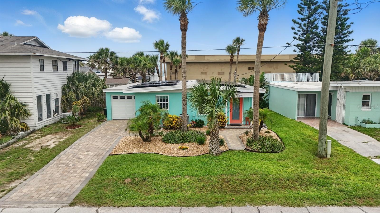 Nestled just one block from the ocean, this charming 3-bedroom, 2-bath beach bungalow blends comfort and coastal living. Featuring an open floor plan, vaulted ceilings, and abundant
natural light, this home invites relaxation. Recent upgrades include two Lennox mini-split systems, an additional bathroom mini-split (2023), a tankless hot water heater (2024), and a
new heat pump (2024). Energy efficiency is enhanced with solar panels added in 2023, a modern water system (2020), and upgraded windows throughout—front and rear
(2021)—along with a new rear door. The roof was replaced in 2020, and custom closet renovations were completed the same year. Enjoy a modern kitchen, a spacious primary suite
with private bath, and a serene backyard with patio, perfect for soaking up the sea breeze. Walk or bike to Flagler Beach Pier, local shops, and waterfront restaurants like The Golden
Lion and Break Awayz. Ideal as a full-time residence or vacation getaway in a golf cart-friendly beach town.