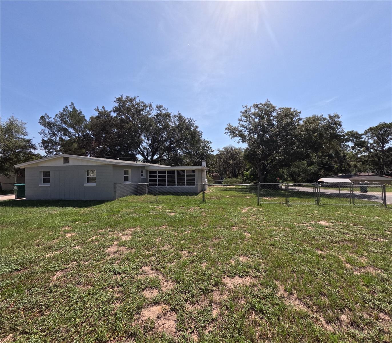 Completely renovated 3-bedroom, 2-bath home in Fruitland Park! Features ceramic tile throughout, modern kitchen with stainless steel appliances, interior laundry with washer & dryer, and updated bathroom. Spacious yard, long driveway, and great natural light. Quiet neighborhood with no HOA. Close to US-27, Walmart, USPS & Hospital. Ready for immediate move-in! Pets welcome