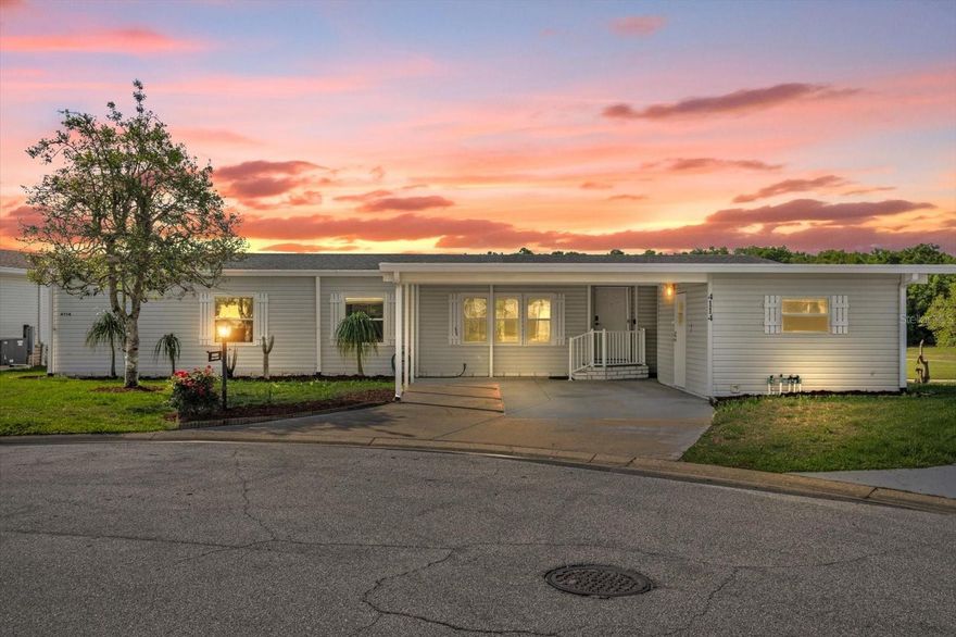 Drive into Peace and Tranquility and experience the pinnacle of the Zellwood Station lifestyle in this expansive, meticulously maintained 3/2 "Executive" home. Perfectly positioned on a quiet cul-de-sac. This residence offers breathtaking Unobstructed views of the golf course and lake directly across the street----providing a picturesque backdrop for your morning coffee without  the "on-the-green" foot traffic. Step inside to find a modern, open layout that feels more like a traditional site-built home. The heart of the home is the  massive kitchen renovated in 2022, boasting a 5.5 foot Granite Island, an additional Granite coffee bar and upgraded black appliances . The kitchen and the  Florida Room were designed specifically to frame the stunning water and golf views. All popcorn ceilings have been professionally scraped and painted, giving the entire home  a crisp, contemporary feel.  With nearly 2000 square feet of heated living space, you'll enjoy a formal dining room (18x17),  a dedicated dining room and an additional family room (14x13). The Primary Suite is a true retreat (16x13) featuring a large walk-in closet and double vanity. This home features A NEWER ROOF (2017) High-Efficiency 3.5 Ton A/C (2021), Screened Porch converted to Florida Room 2023 (17x11) with a new Split System. THE LOW PROFILE ENTRY WITH A WIDE LANDING AND HANDICAP-ACCESIBLE DOOR provides ease of entry rarely found in the community. ZELLWOOD IS A PREMIER 24/7 GUARD-GATED 55+ Community, featuring 18 hole golf course, on-site restaurant, pools and countless activities. Don't wait---homes with this combination of square footage and views are a rare find!!!!