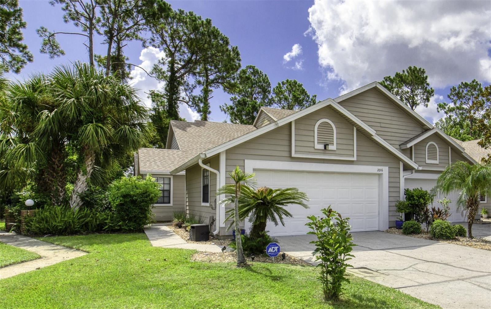 Welcome to your retreat in the Spruce Creek Fly-In community! This stunning fully furnished 2-bedroom, 2-bathroom one-story condo blends convenience and elegance—perfect to call home. Step inside to an open-concept layout filled with laminate flooring throughout the main living areas. The eat-in kitchen is a chef's delight, with modern appliances and ample counter space for cooking or casual dining. The spacious living area boasts vaulted ceilings, adding to the home's airy feel. Relax in your serene Florida room—ideal for morning coffee or winding down with a book. Both bedrooms offer generous closet space and comfort, perfect for recharging after long days. Just steps away are the community pool and clubhouse—great for splashing, socializing, and soaking in the vibrant atmosphere. Spruce Creek Fly-In features amazing amenities (separate fees apply), including tennis, popular pickleball courts, an onsite restaurant, and a golfer's paradise—all in a unique gated airpark community.