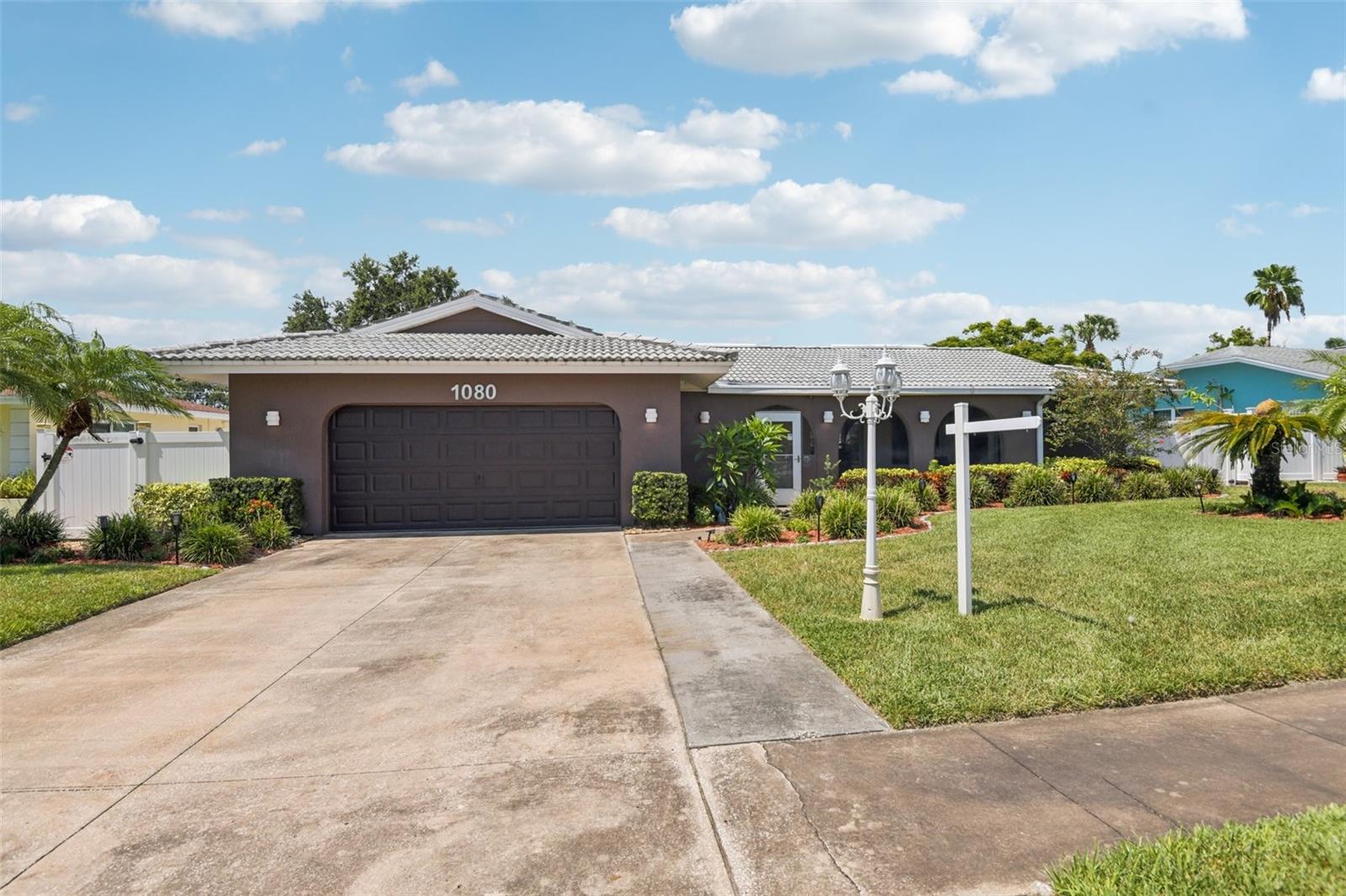 One or more photo(s) has been virtually staged. Spacious 4-bedroom, 3-bath pool home in sought-after Pinehurst Highlands, just a mile from charming downtown Dunedin. Enjoy easy access to the Pinellas Trail, Hammock Park, Dunedin Arts Center, and the nearby community center—golf cart friendly! A few blocks from Highlander Park with its sports complex and public pool. Love the outdoors? You'll be just minutes from the beach and the natural beauty of Honeymoon Island. The home features a 30-year roof (15 years old), HVAC system updated in 2022, a brand-new water heater, and a new water softener. This inviting property offers a wonderful blend of comfort, convenience, and location—perfect for anyone looking to enjoy the best of Dunedin living.